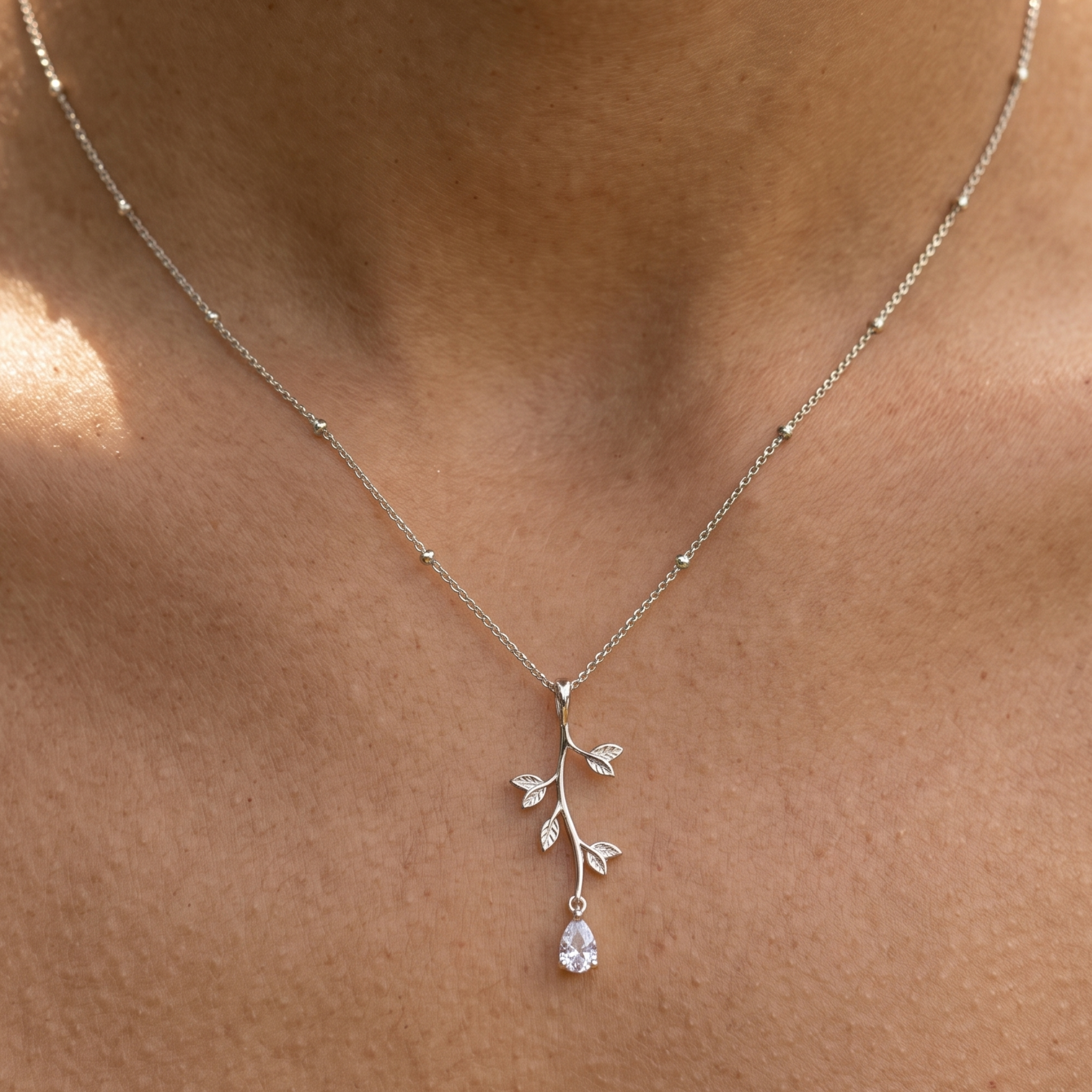 Kiashaa Jewellery 0.39 CT pear diamond leaf pendant necklace in polished yellow gold.