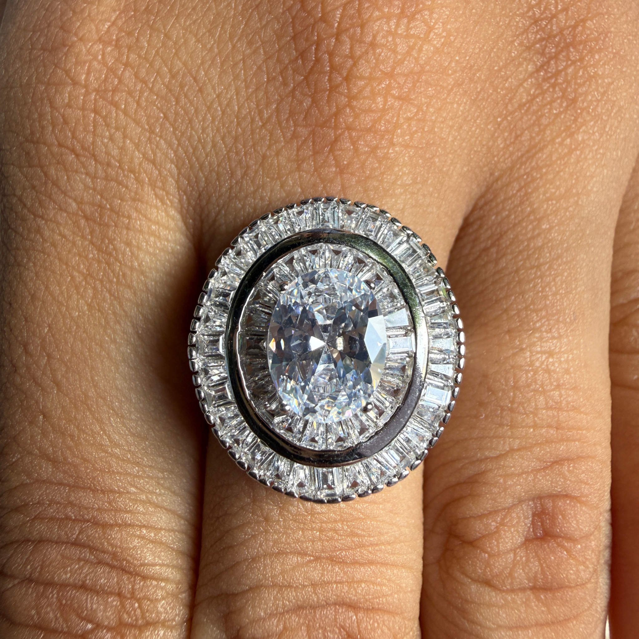 Oval and baguette lab-grown diamond double halo ring by Kiashaa Jewellery.