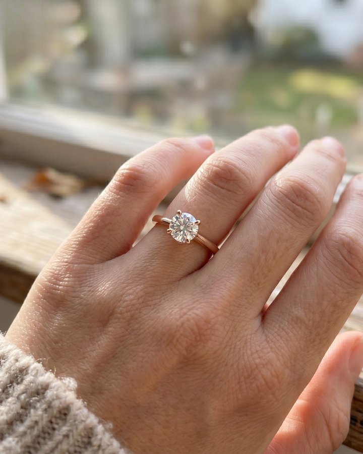 Ladies round lab-grown diamond hidden halo ring by Kiashaa Jewellery in rose gold for engagements and proposals.