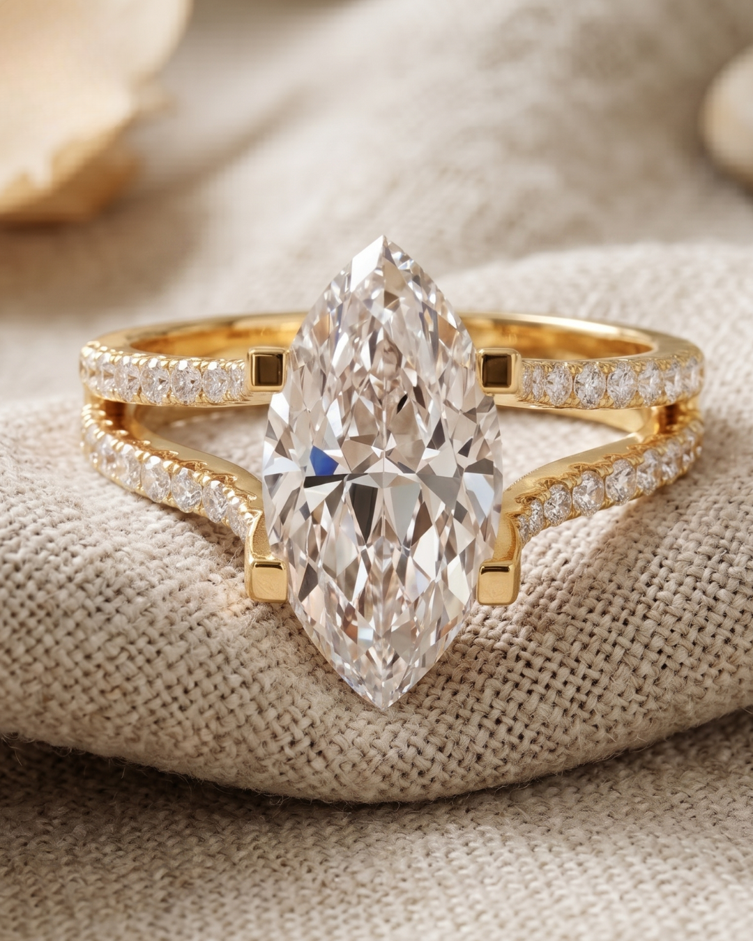 Close-up of a marquise lab-grown diamond ring by Kiashaa Jewellery with round diamonds set in a rose gold split shank.