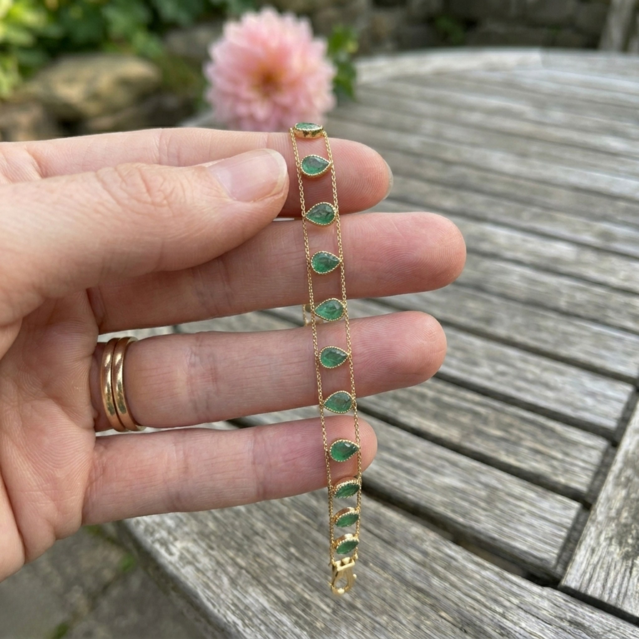 Elegant botanical bracelet with pear and marquise-shaped green crystal stations.