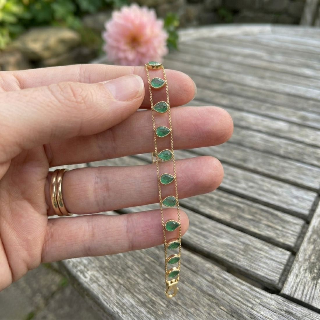 Elegant botanical bracelet with pear and marquise-shaped green crystal stations.