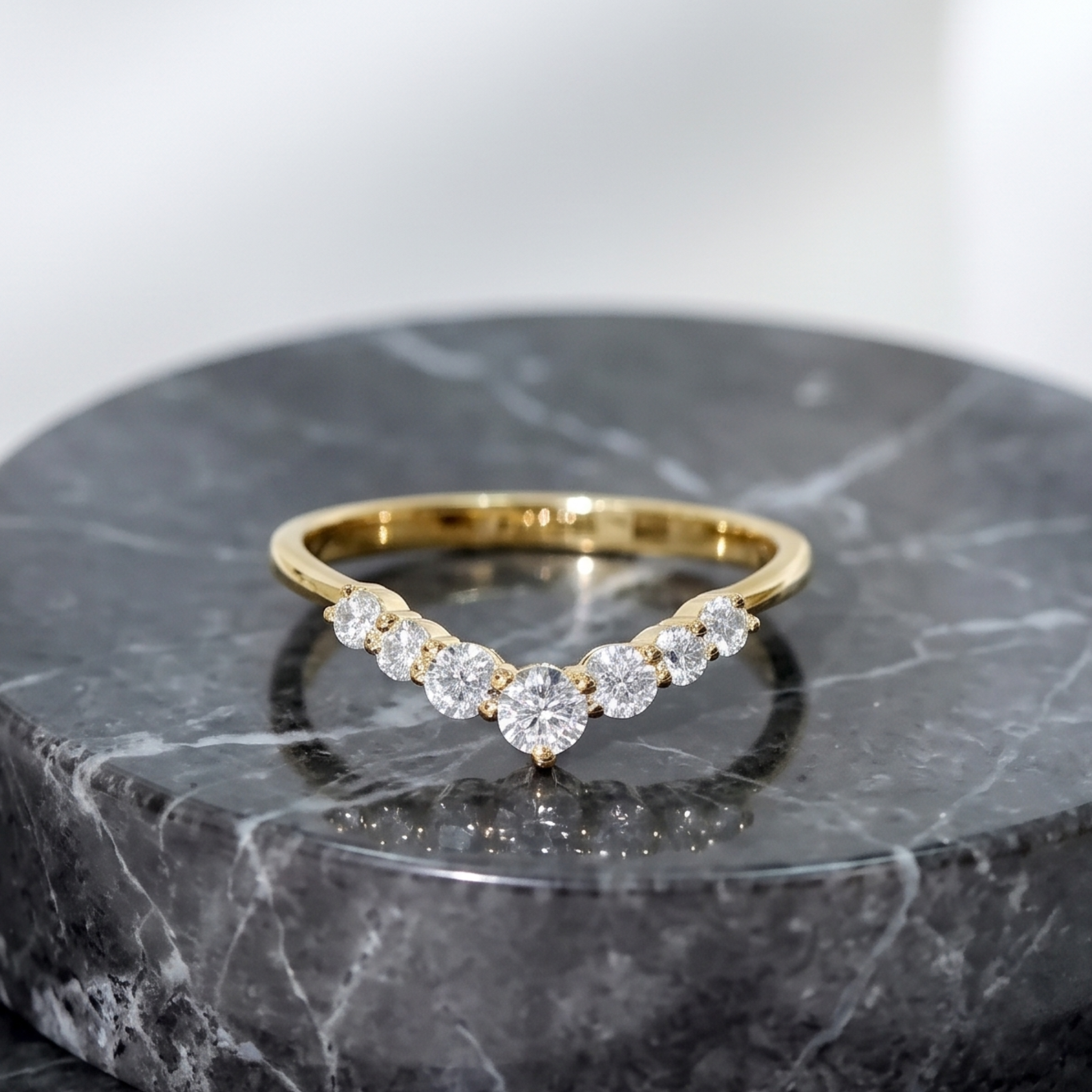 Elegant graduated diamond chevron wedding band for women