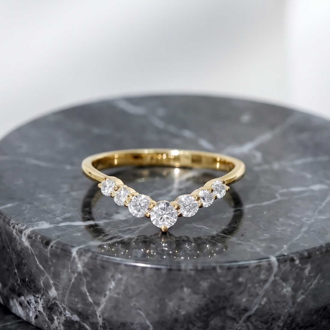 Elegant graduated diamond chevron wedding band for women