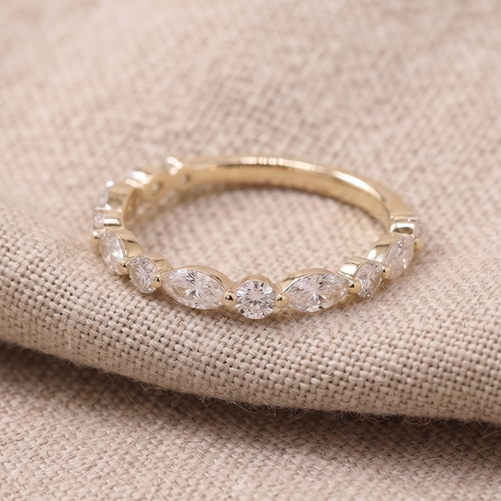 Marquise and round diamond wedding band by Kiashaa Jewellery in polished yellow gold.