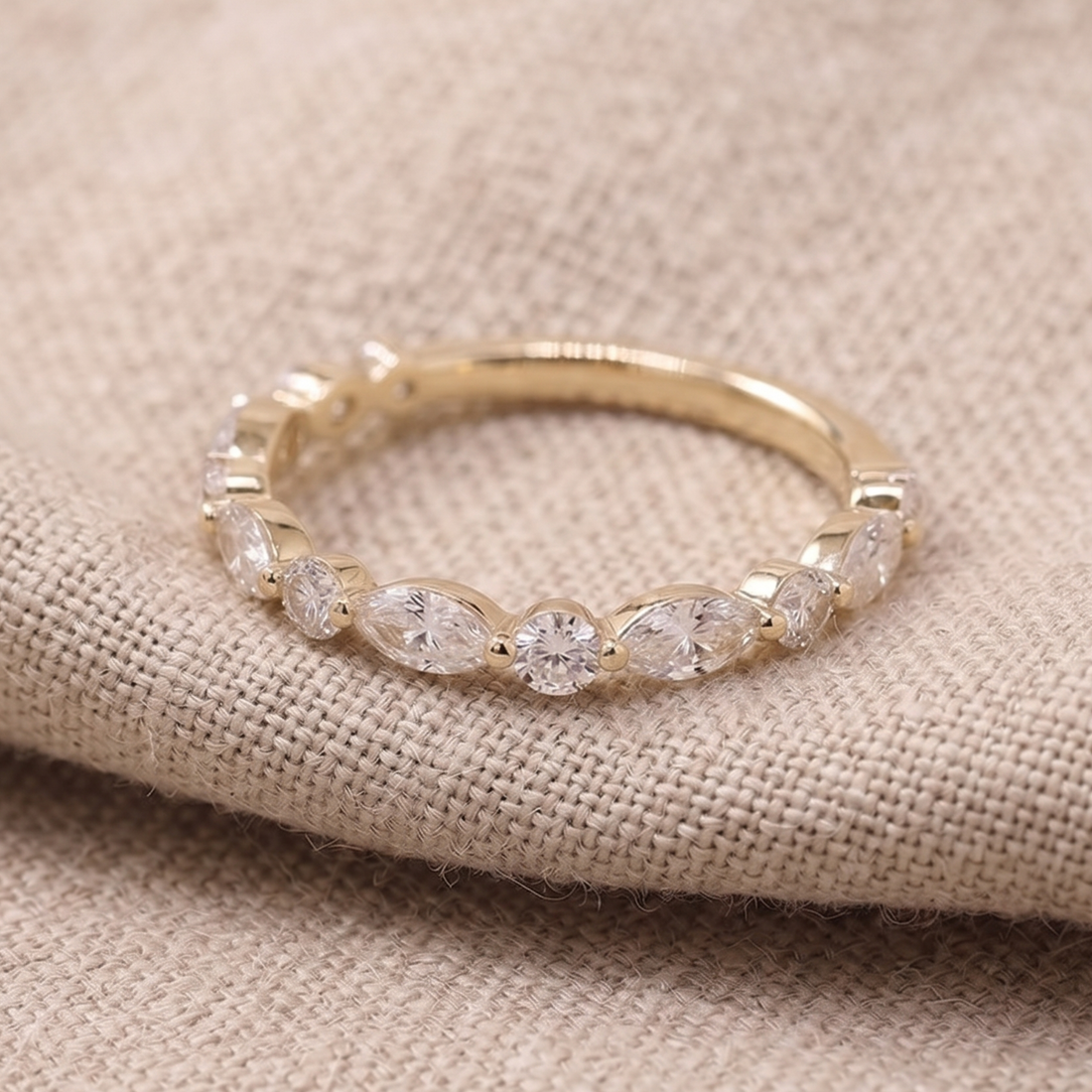 Marquise and round diamond wedding band by Kiashaa Jewellery in polished yellow gold.