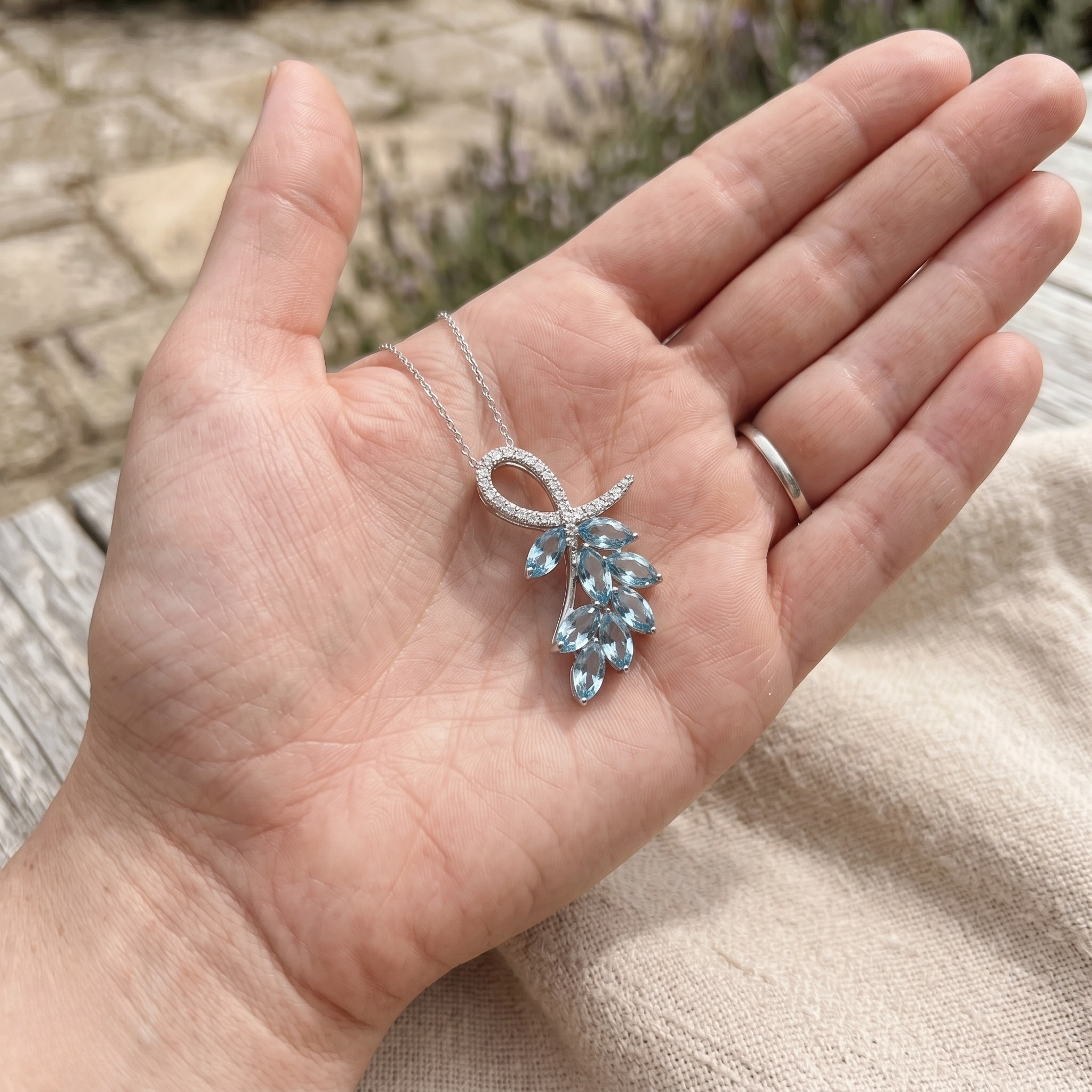 Sky blue marquise gemstone leaf pendant necklace with lab-grown diamonds by Kiashaa Jewellery.