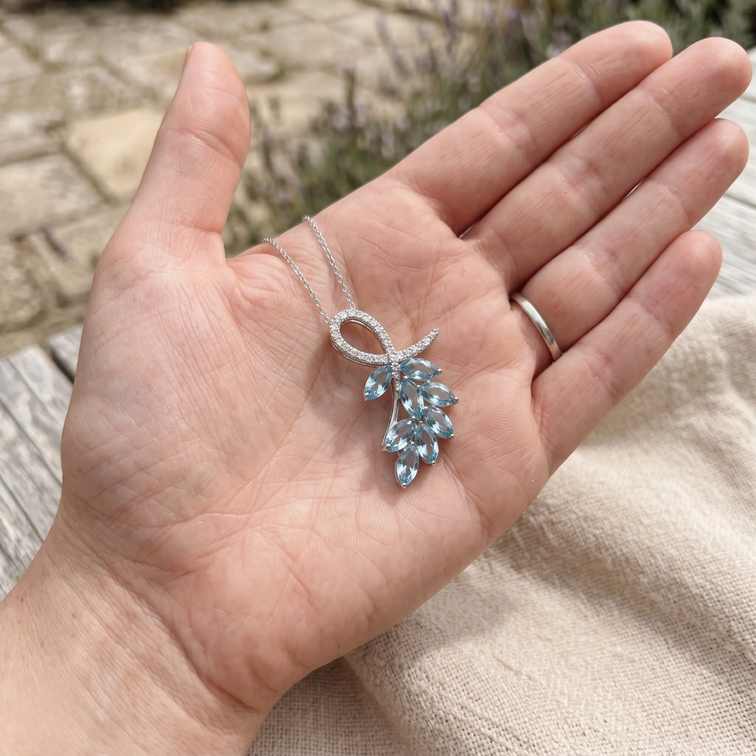 Sky blue marquise gemstone leaf pendant necklace with lab-grown diamonds by Kiashaa Jewellery.