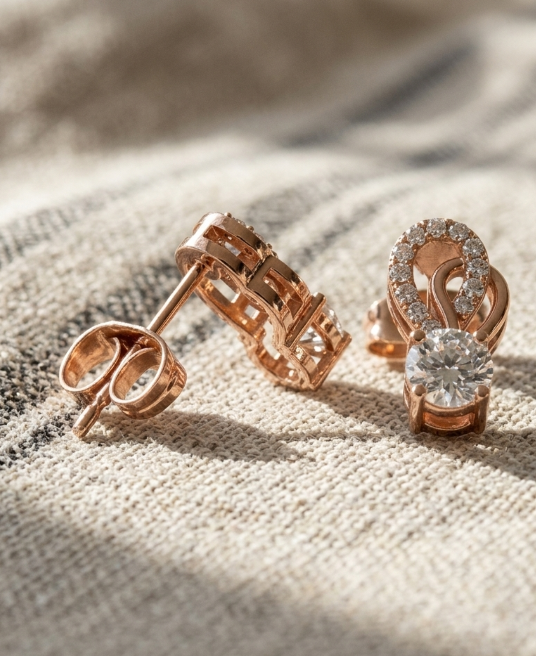 Back view of rose gold diamond loop earrings showing straight posts and push-back closures.