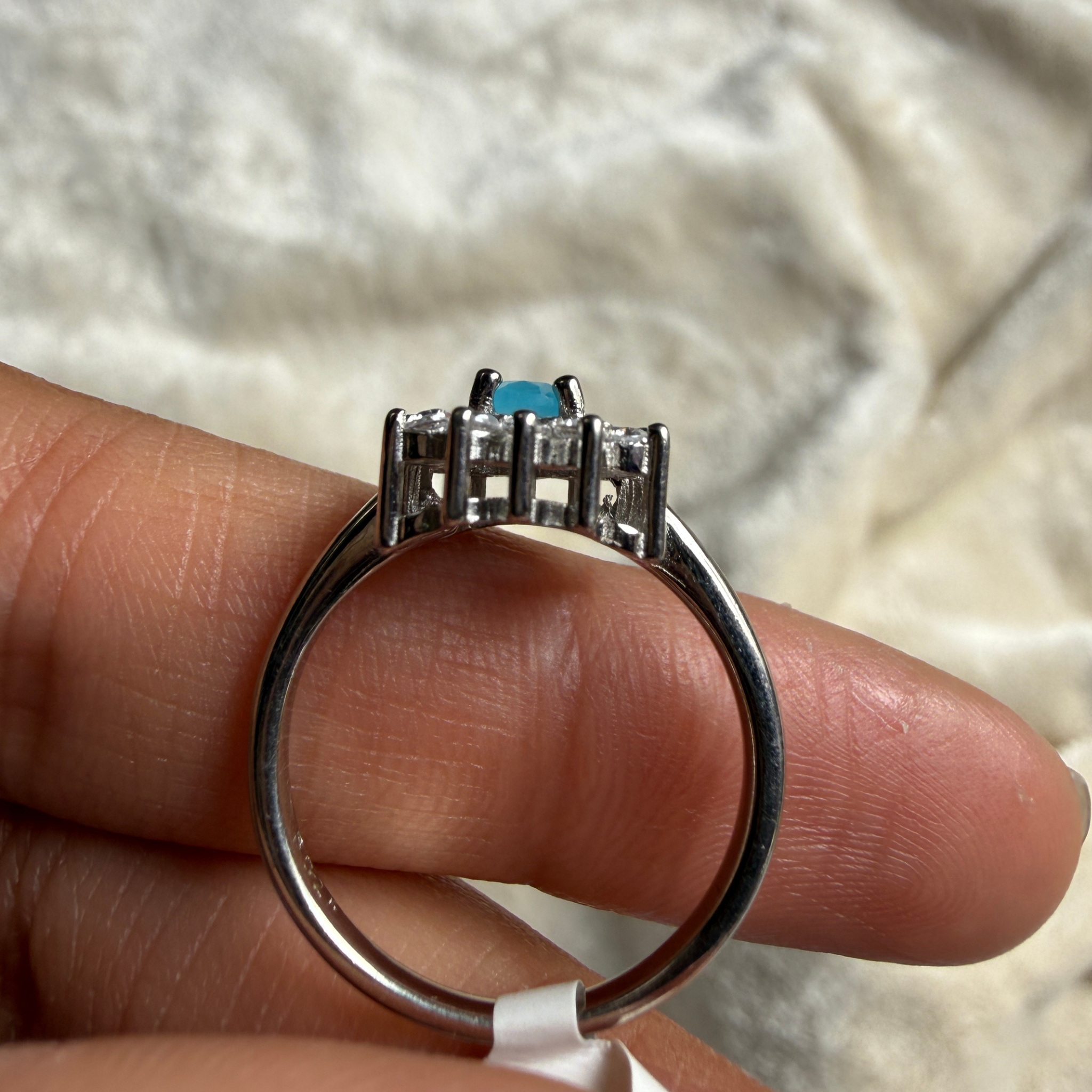 Sky blue oval gemstone and lab-grown diamond halo ring by Kiashaa Jewellery.