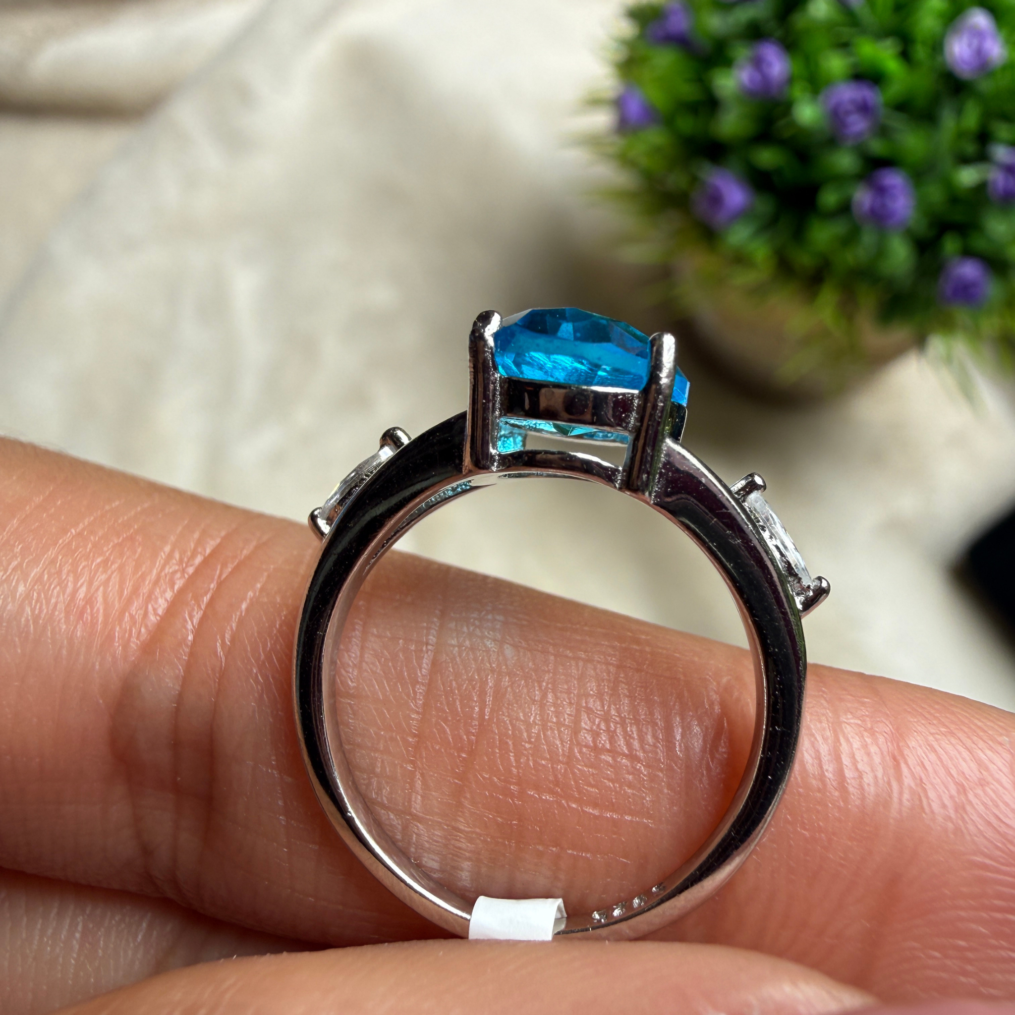 Blue oval gemstone solitaire ring with marquise lab-grown diamonds by Kiashaa Jewellery.