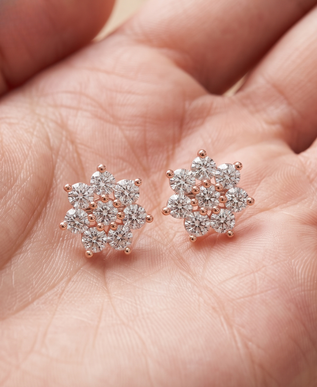 Ladies floral cluster diamond studs by Kiashaa Jewellery in rose gold with post and push-back closures.