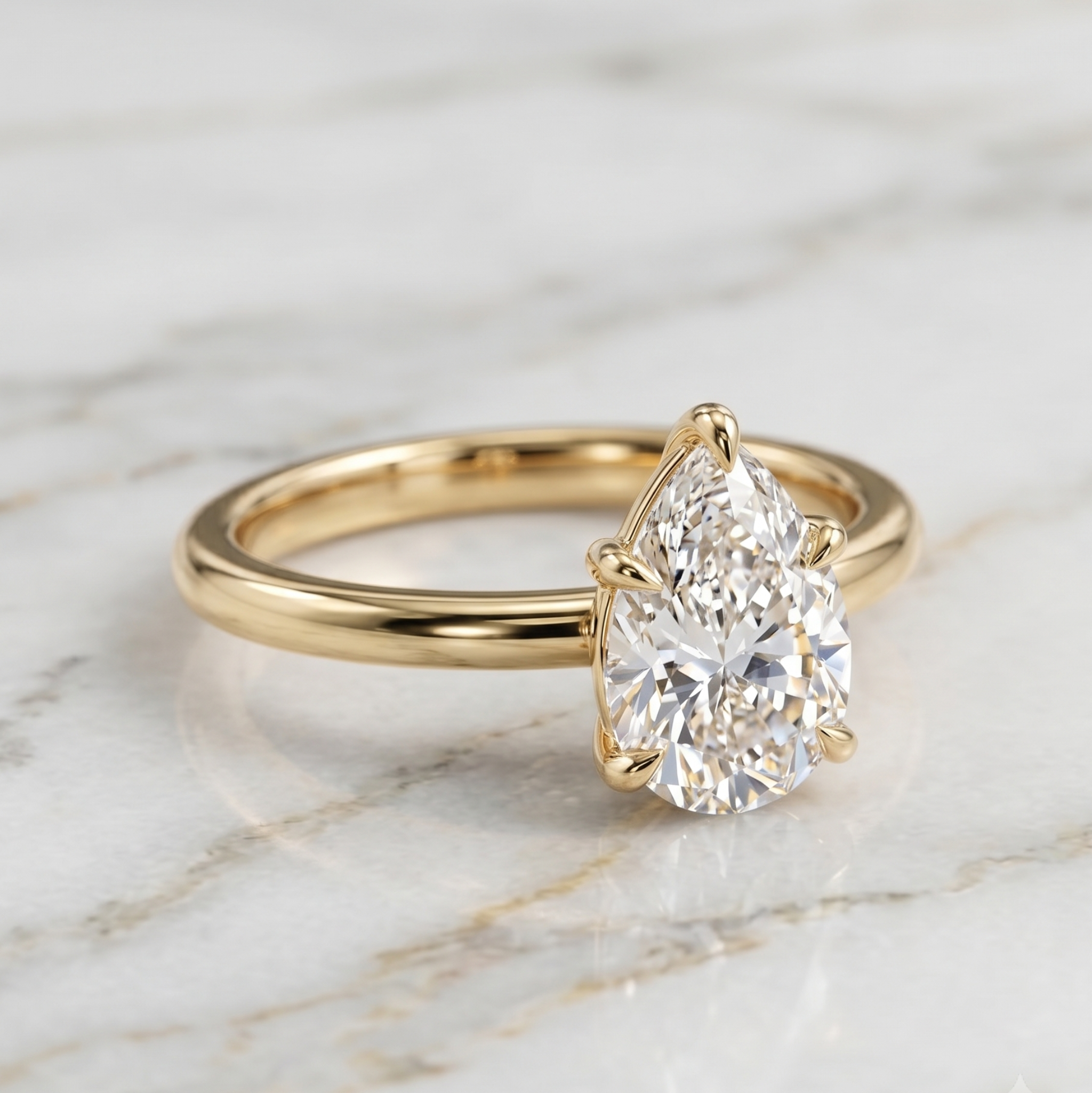 Three-prong 7 × 5 mm pear diamond engagement ring
