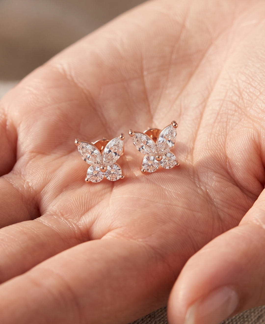 Close-up of butterfly lab-grown diamond earrings with secure prong settings and polished finish