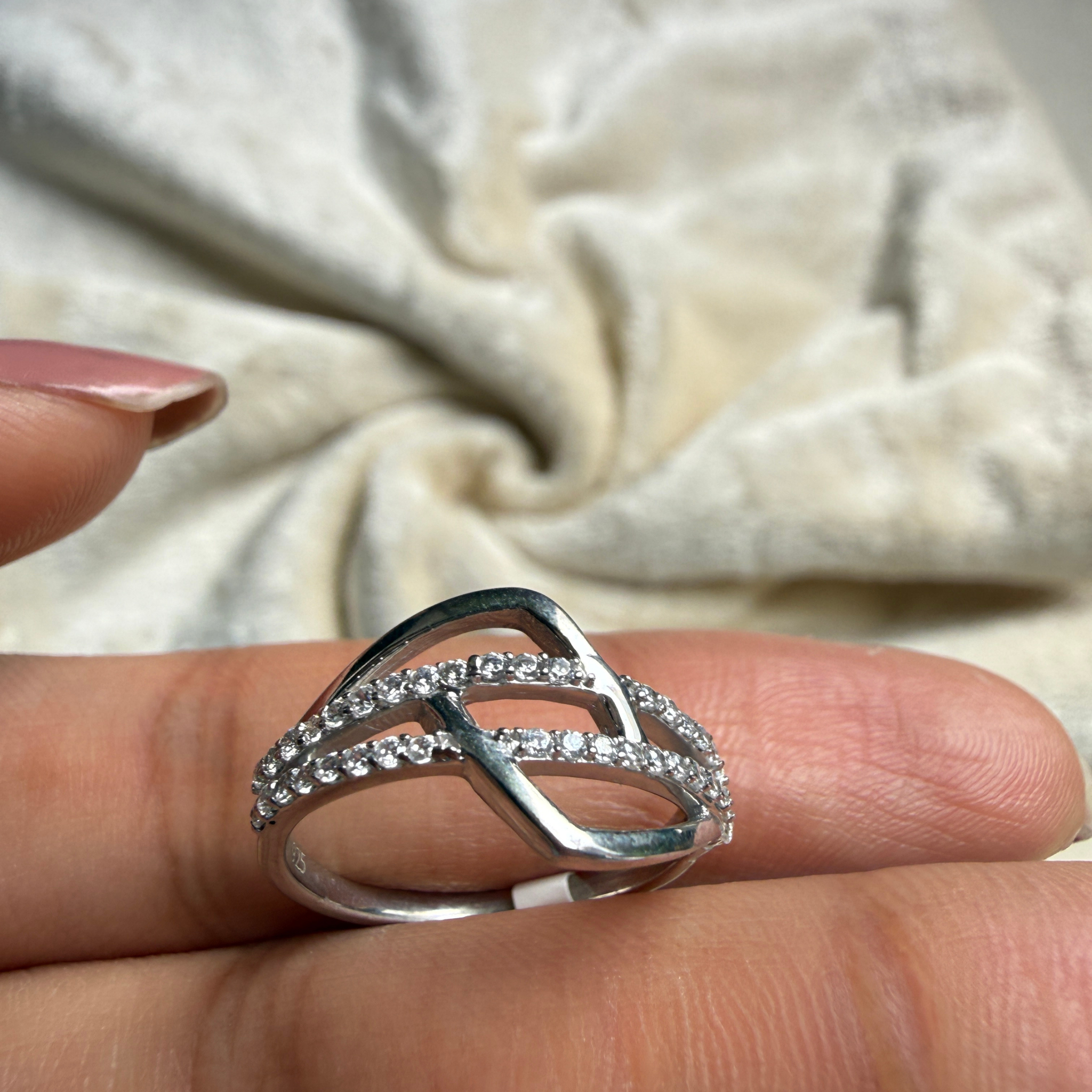Contemporary open-frame diamond ring handcrafted in 9K, 14K and 18K gold.