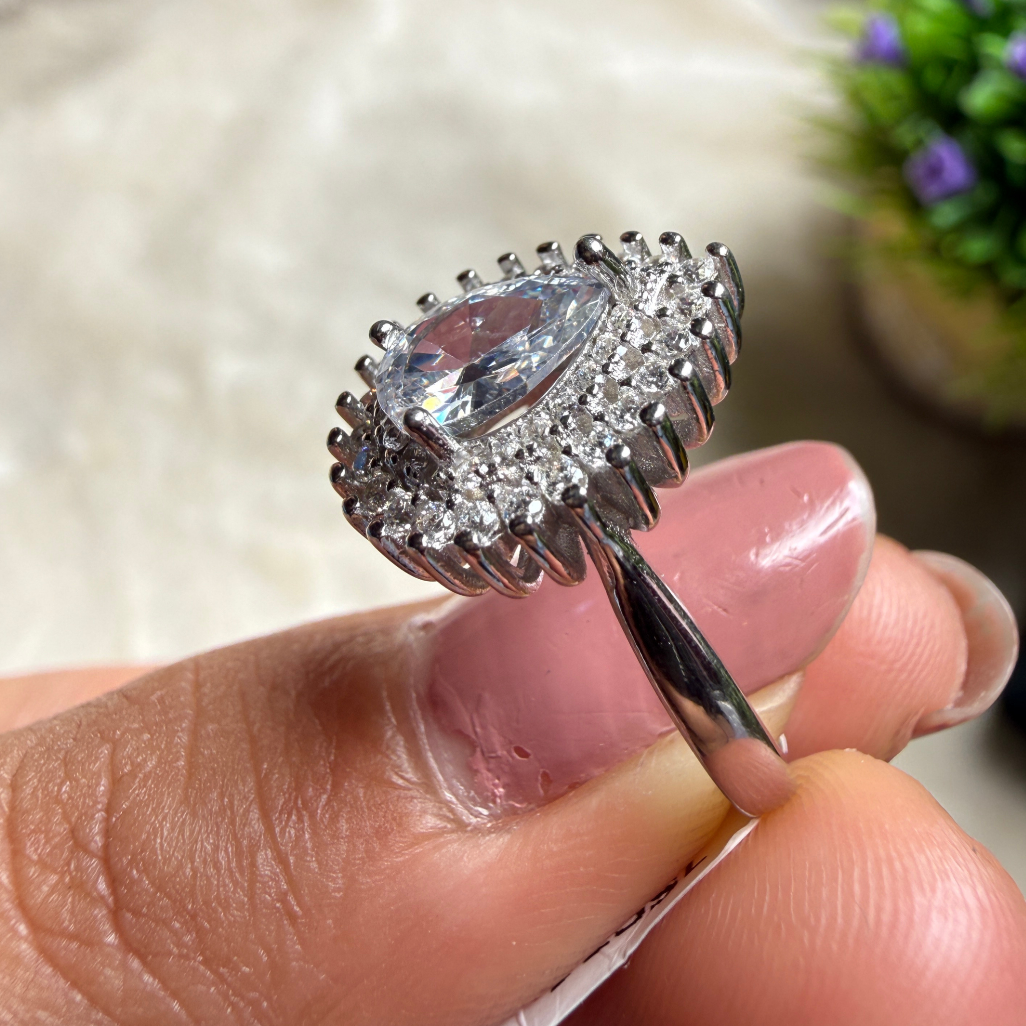 Pear halo lab-grown diamond engagement ring in white gold by Kiashaa Jewellery.