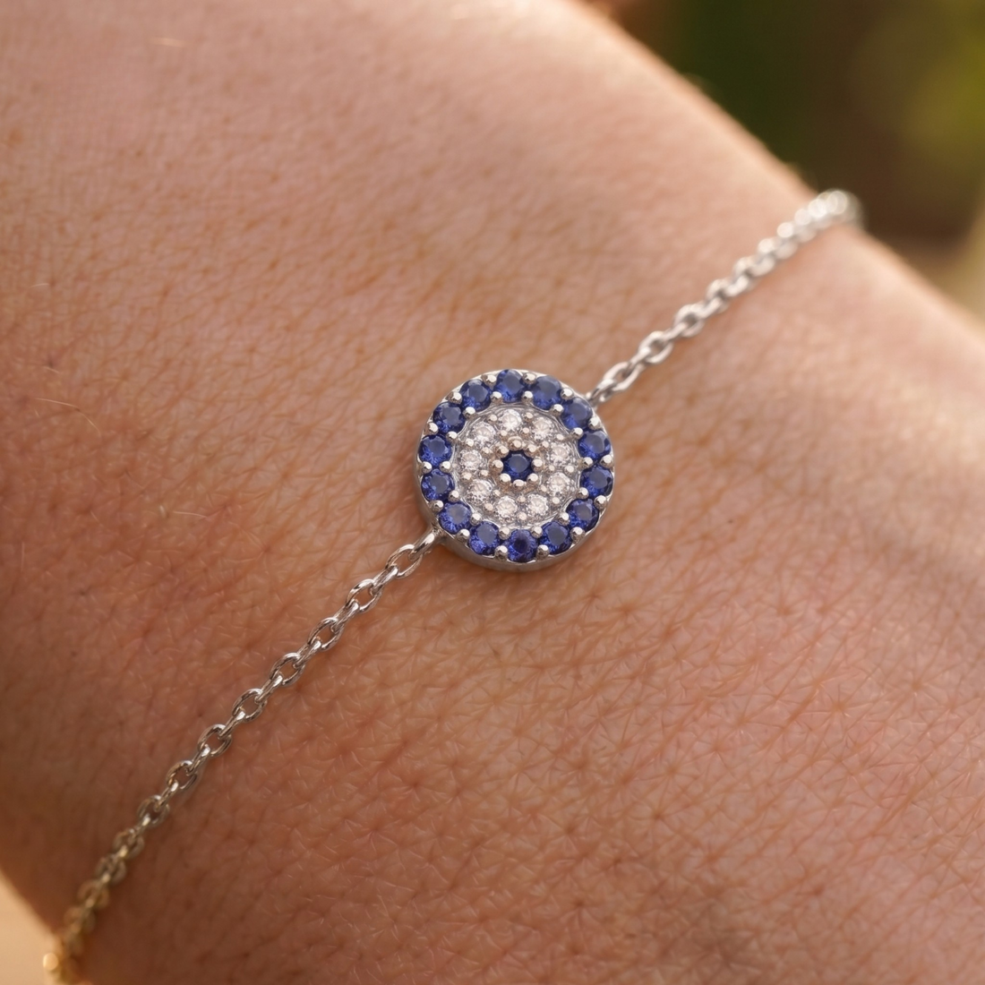 1.00 CT blue gemstone and diamond evil eye bracelet in yellow gold by Kiashaa Jewellery.