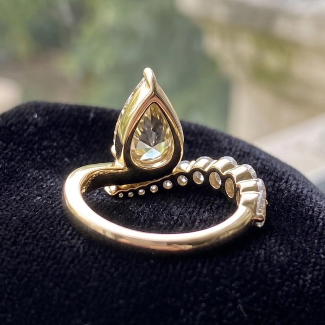 Aurelia 4.50 CTW pear diamond bypass ring by Kiashaa Jewellery featuring a 3 CT pear center diamond in polished yellow gold.