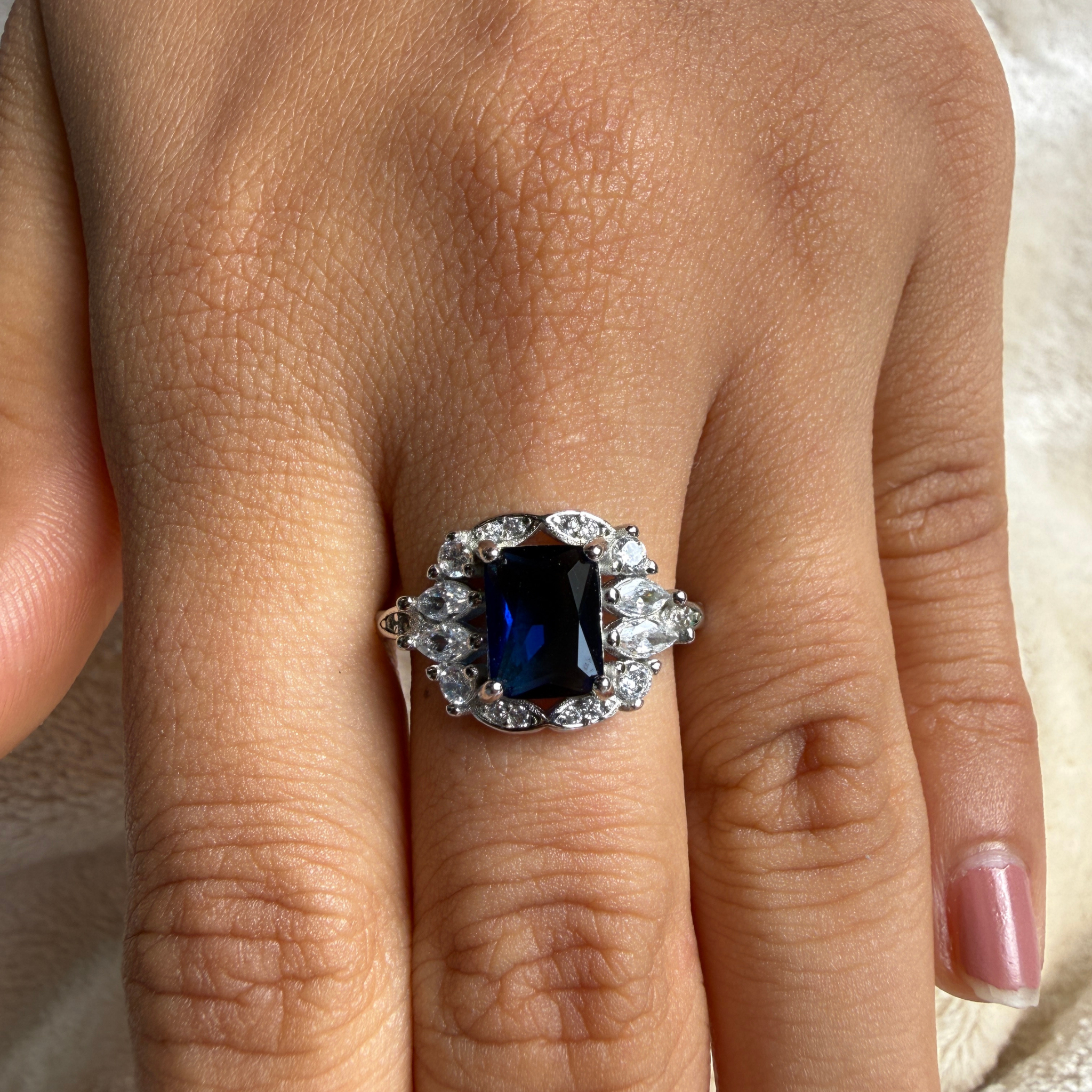 Blue emerald gemstone and lab-grown diamond halo ring by Kiashaa Jewellery.