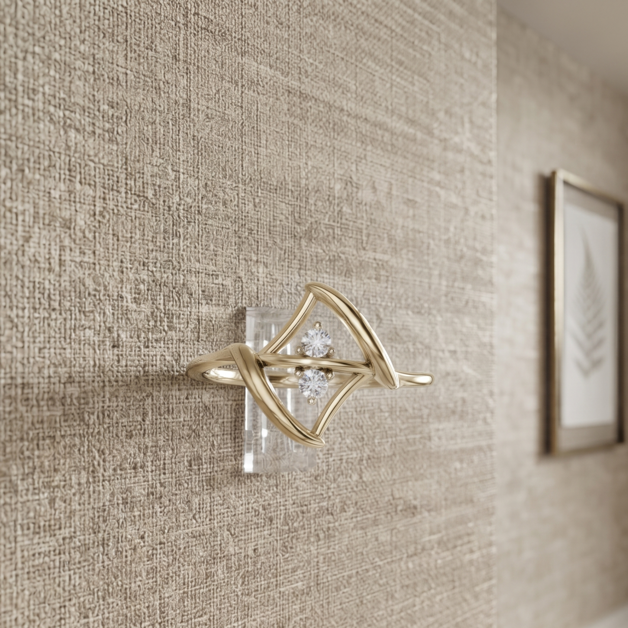 A gold-toned wall-mounted decorative light fixture with a diamond-shaped openwork frame and a small clear crystal center, shown mounted on a textured beige wall in an interior setting.