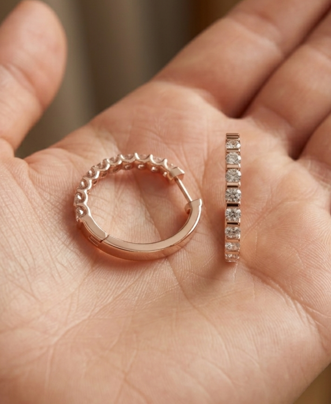 Rose gold round diamond earrings with a softly squared elongated hoop silhouette and high-polish finish.