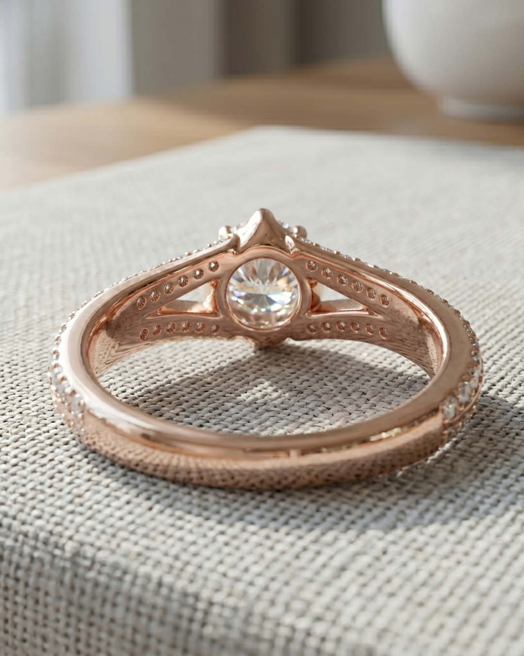 Kiashaa Jewellery round diamond ring in rose gold featuring an infinity-inspired crossover shank design.