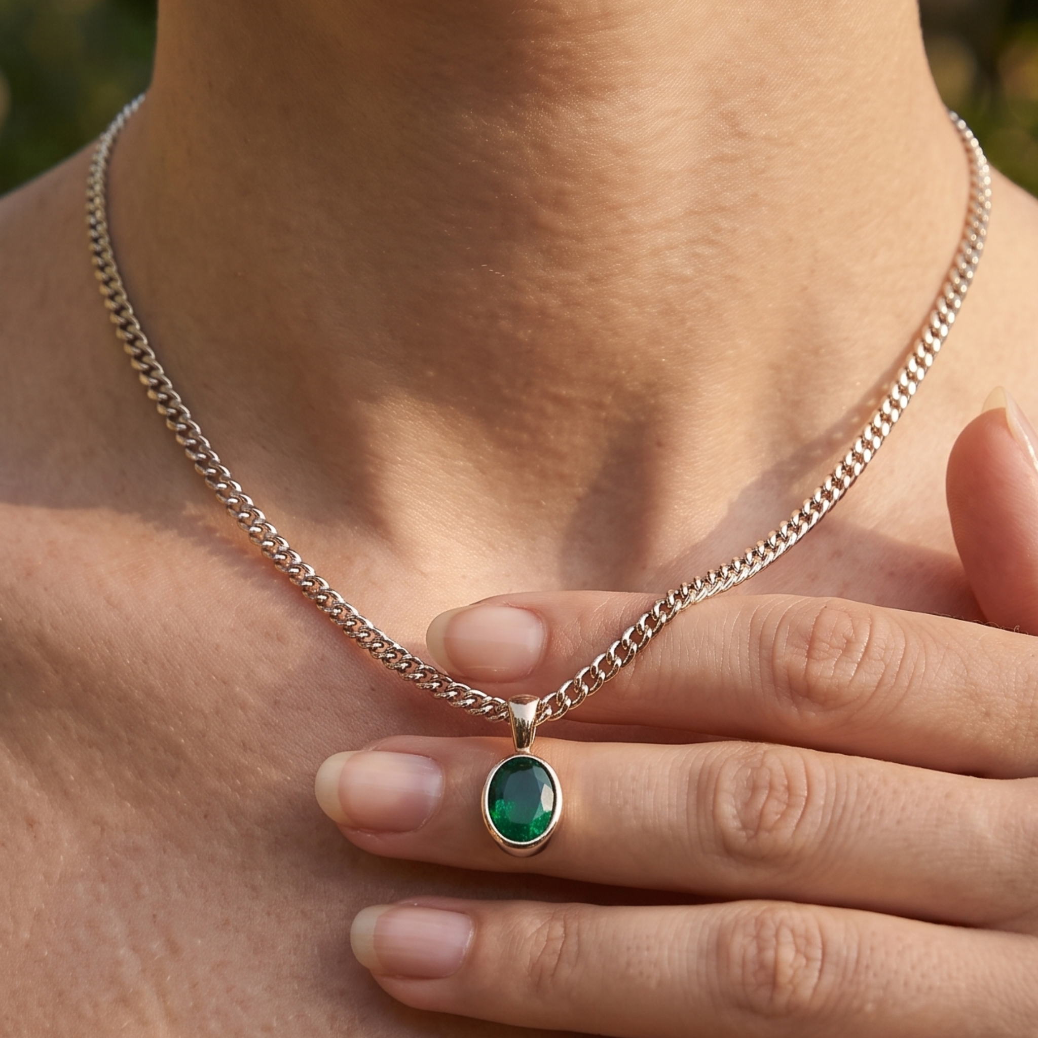 1.98 CT green oval gemstone pendant necklace with polished yellow gold Cuban chain.