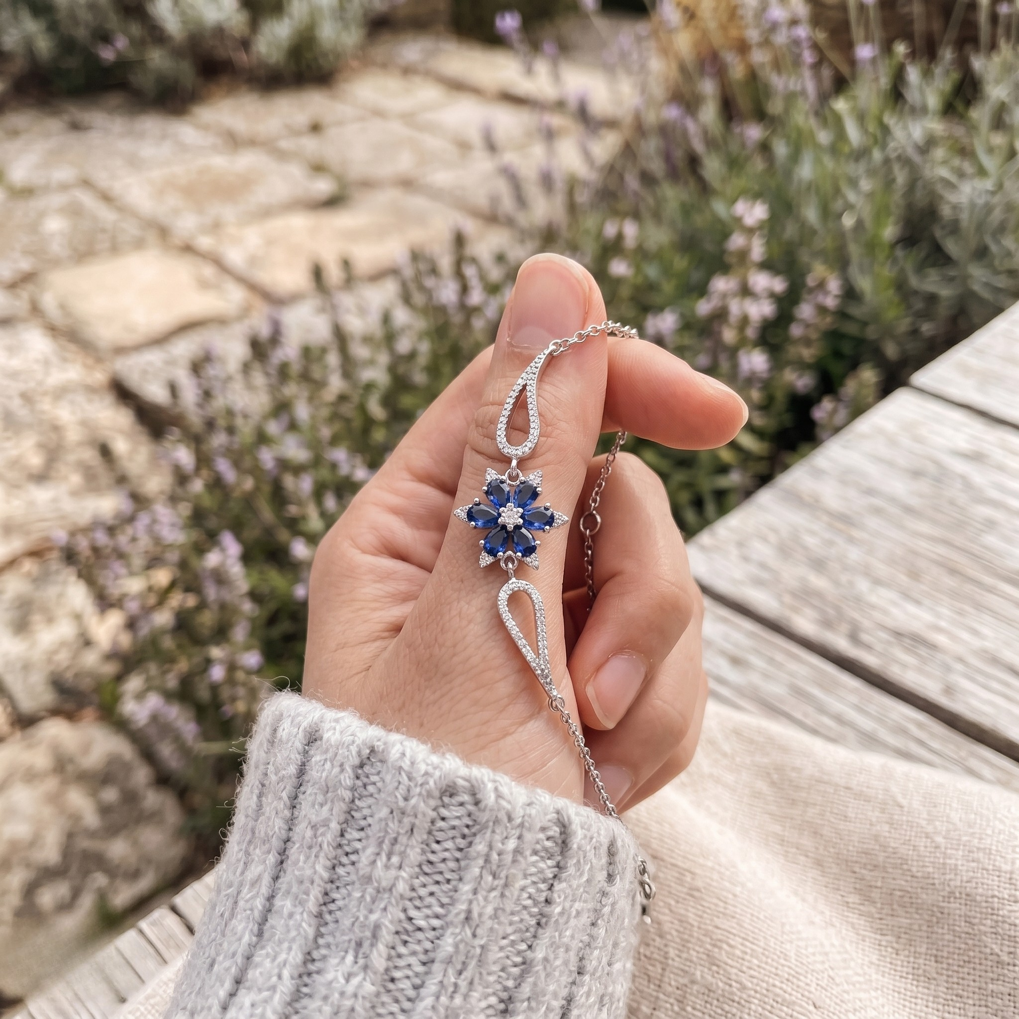 Blue pear gemstone and lab-grown diamond floral bracelet by Kiashaa Jewellery.
