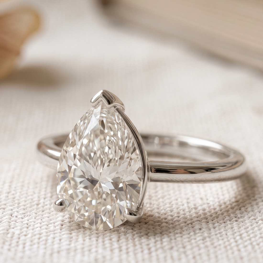 Kiashaa Jewellery 0.76 CT pear solitaire diamond ring in polished yellow gold.