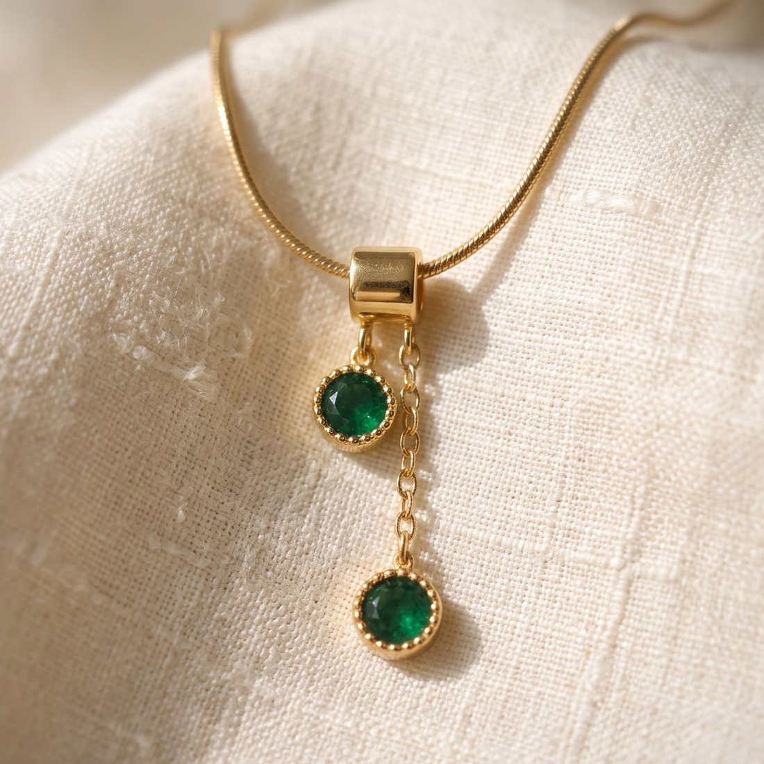  1.50 CTW green round gemstone drop necklace in polished yellow gold.