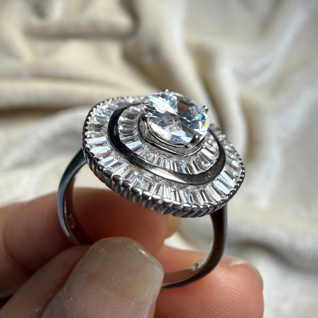 Oval and baguette lab-grown diamond double halo ring by Kiashaa Jewellery.