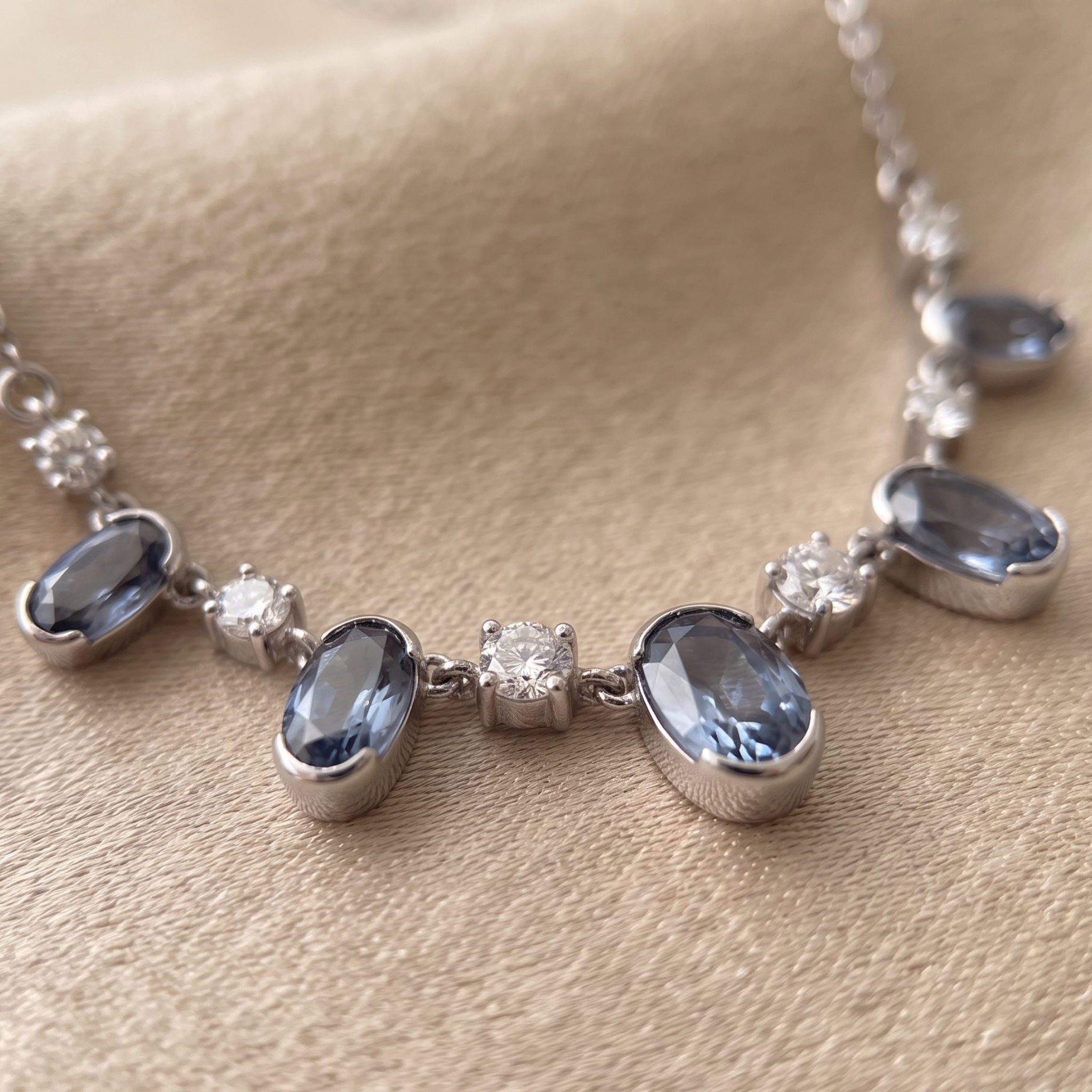 4.20 CTW oval and round diamond station necklace in polished yellow gold.