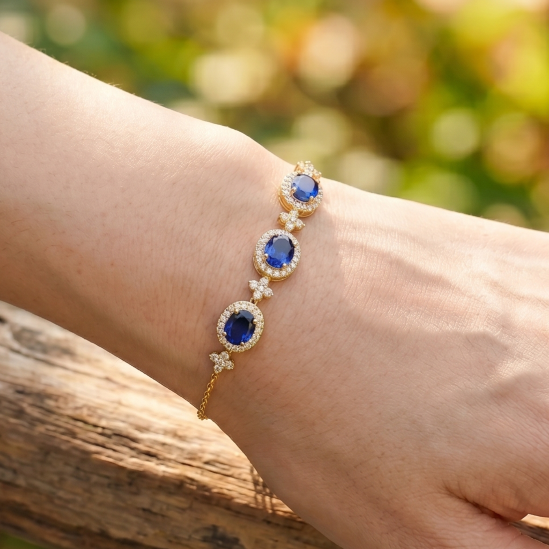 Royal blue oval gemstone bracelet with round lab-grown diamond halos by Kiashaa Jewellery.