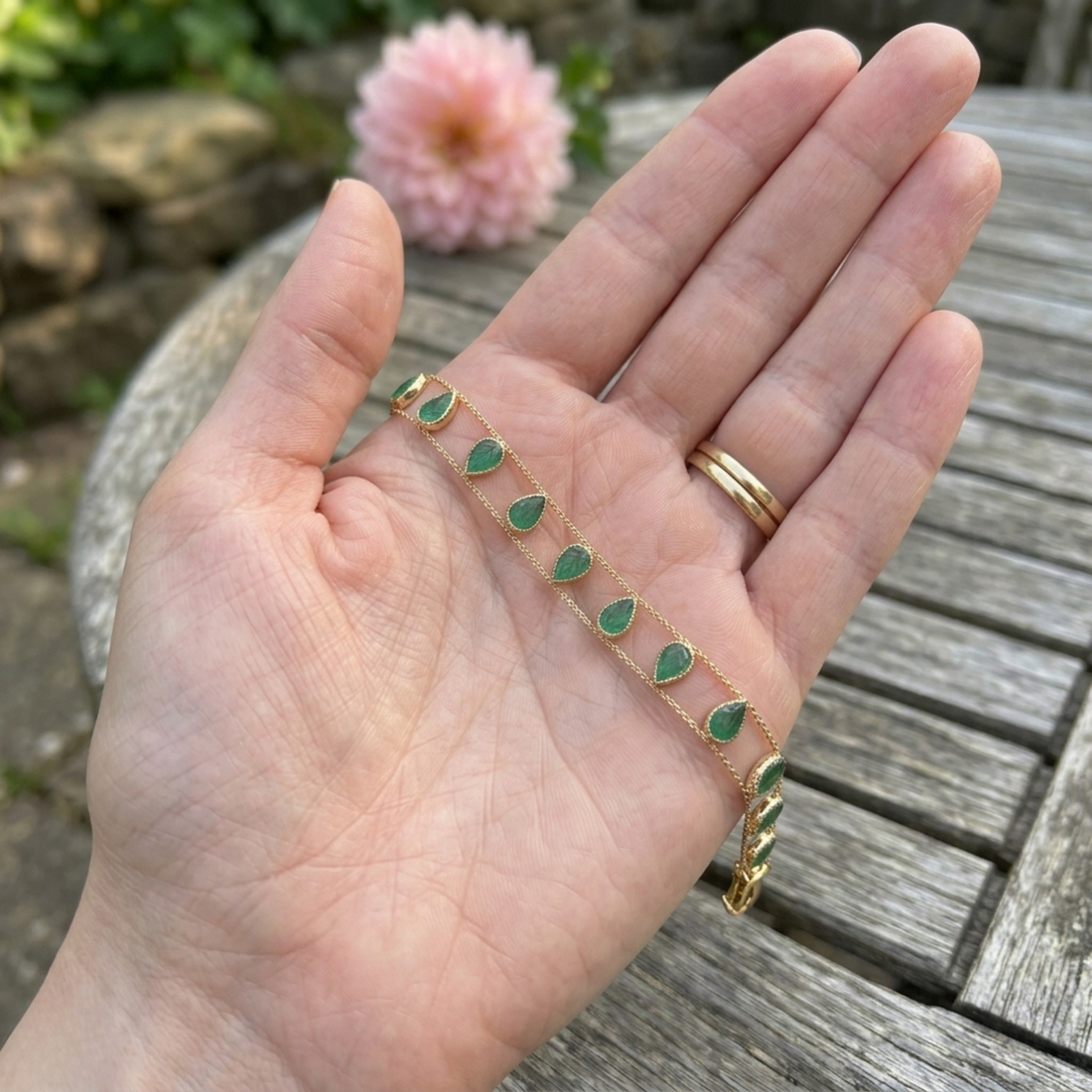 Elegant botanical bracelet with pear and marquise-shaped green crystal stations.