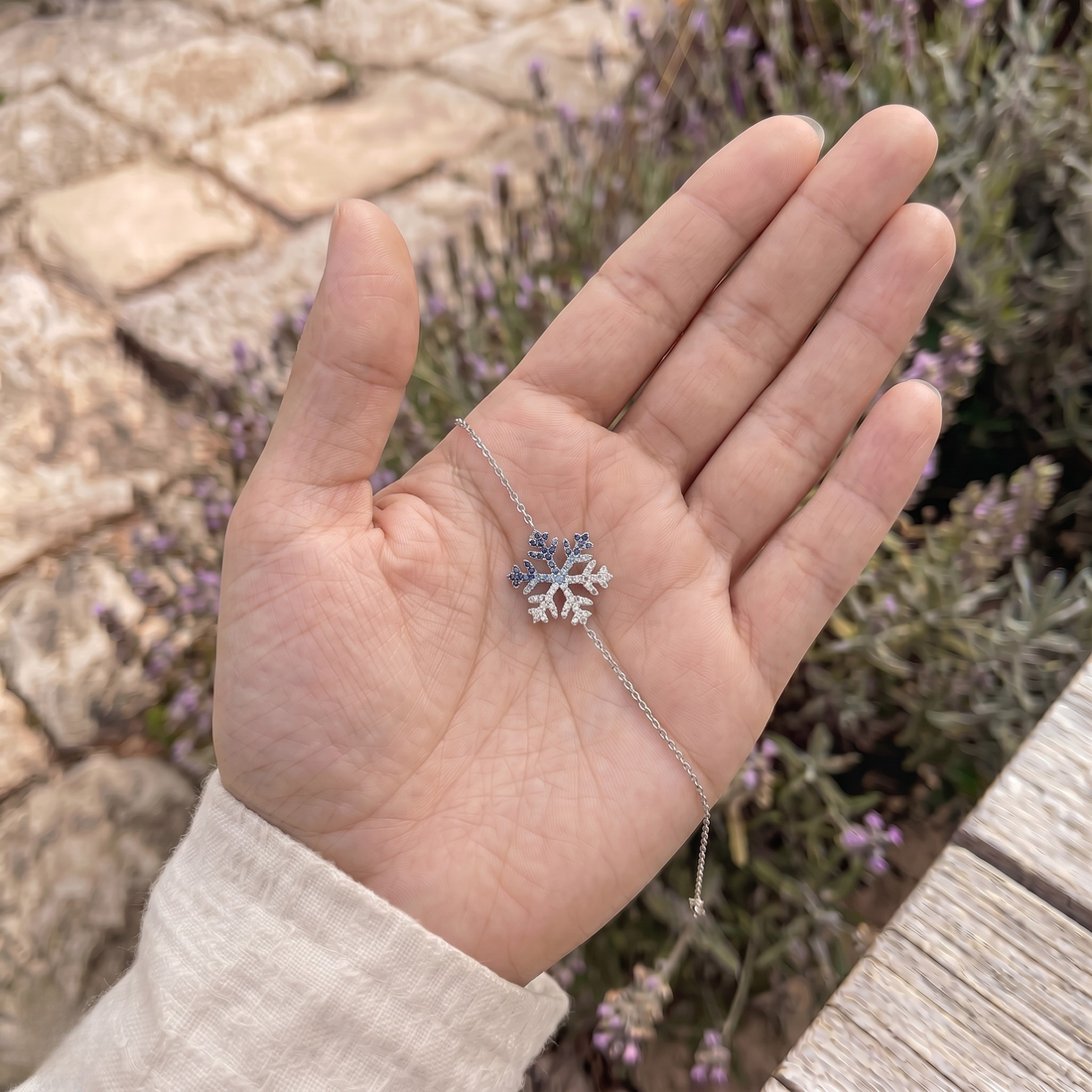 Blue gemstone and lab-grown diamond snowflake bracelet by Kiashaa Jewellery.