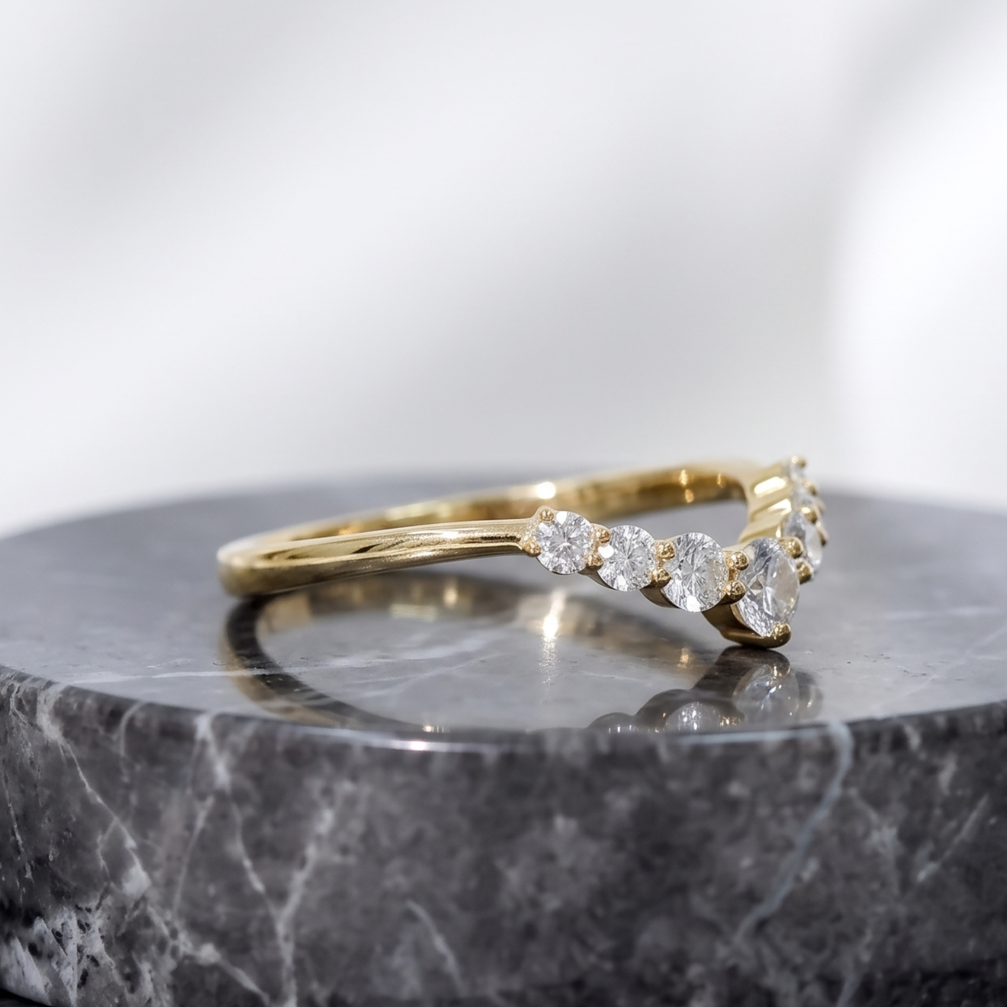Stackable curved diamond ring available in white yellow and rose gold