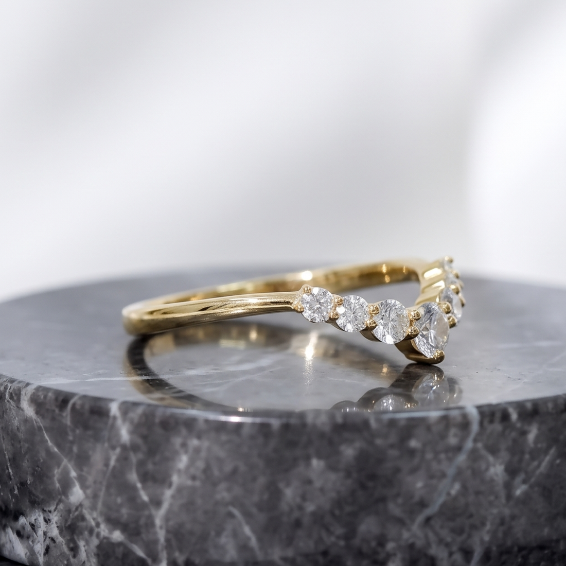 Stackable curved diamond ring available in white yellow and rose gold