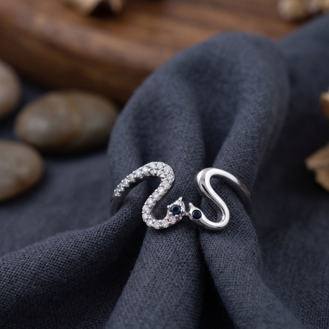 Romantic open ring featuring two swans forming a heart-shaped design.