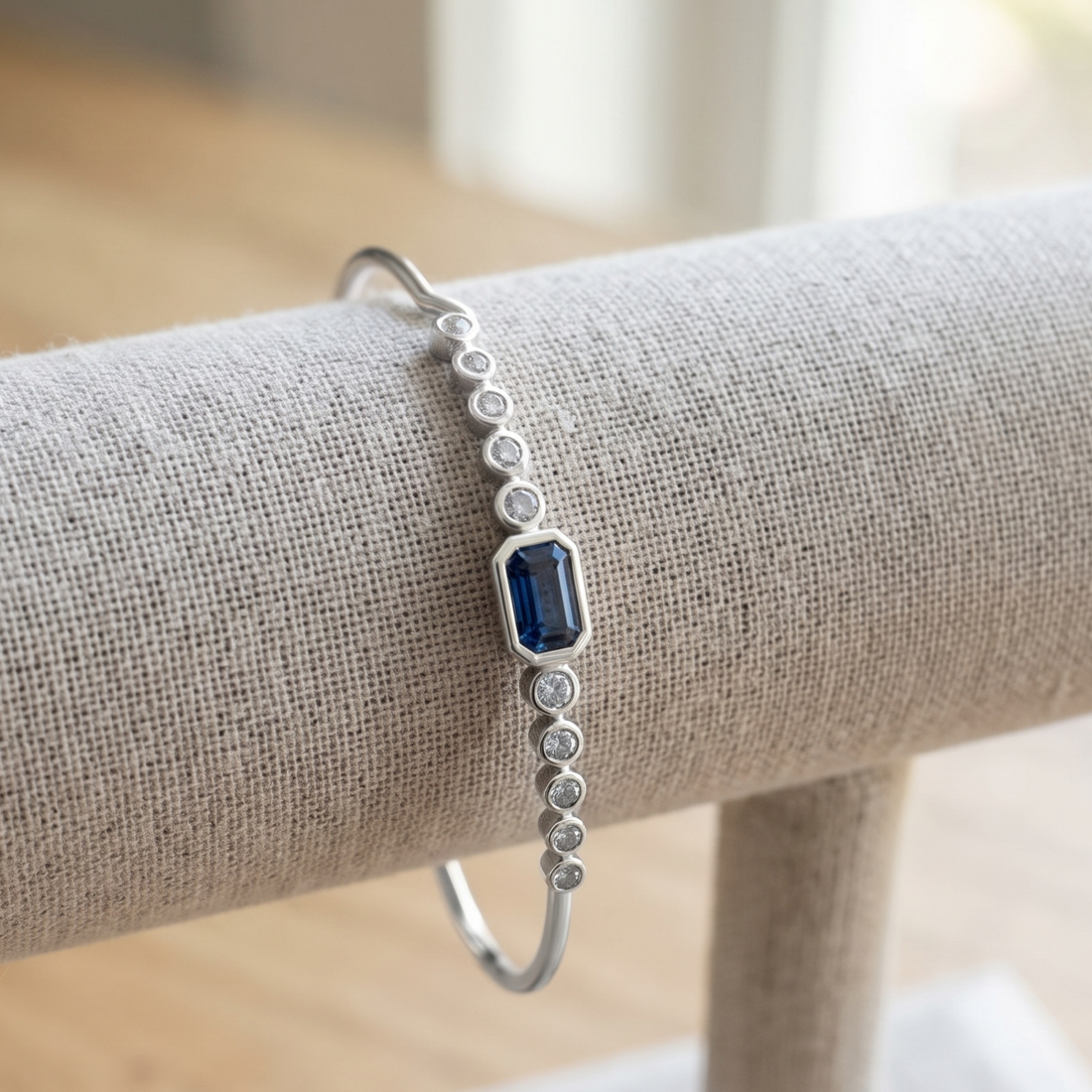 Kiashaa Jewellery 1.582 CTW blue emerald and round diamond bangle in polished yellow gold.