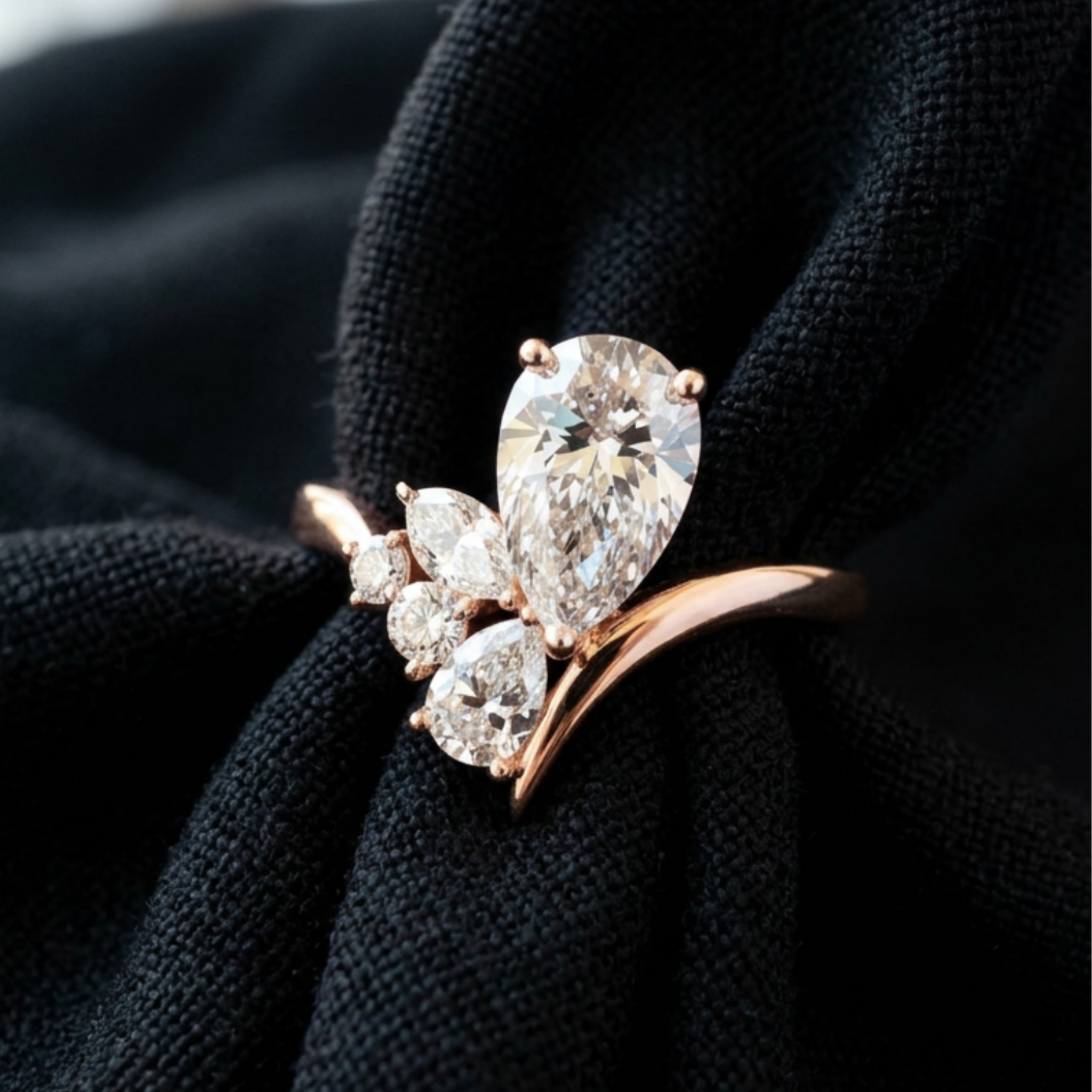 Flora Embrace 3 CTW lab-grown diamond ring by Kiashaa Jewellery with a 2 CT pear center and multi-shape side diamonds.