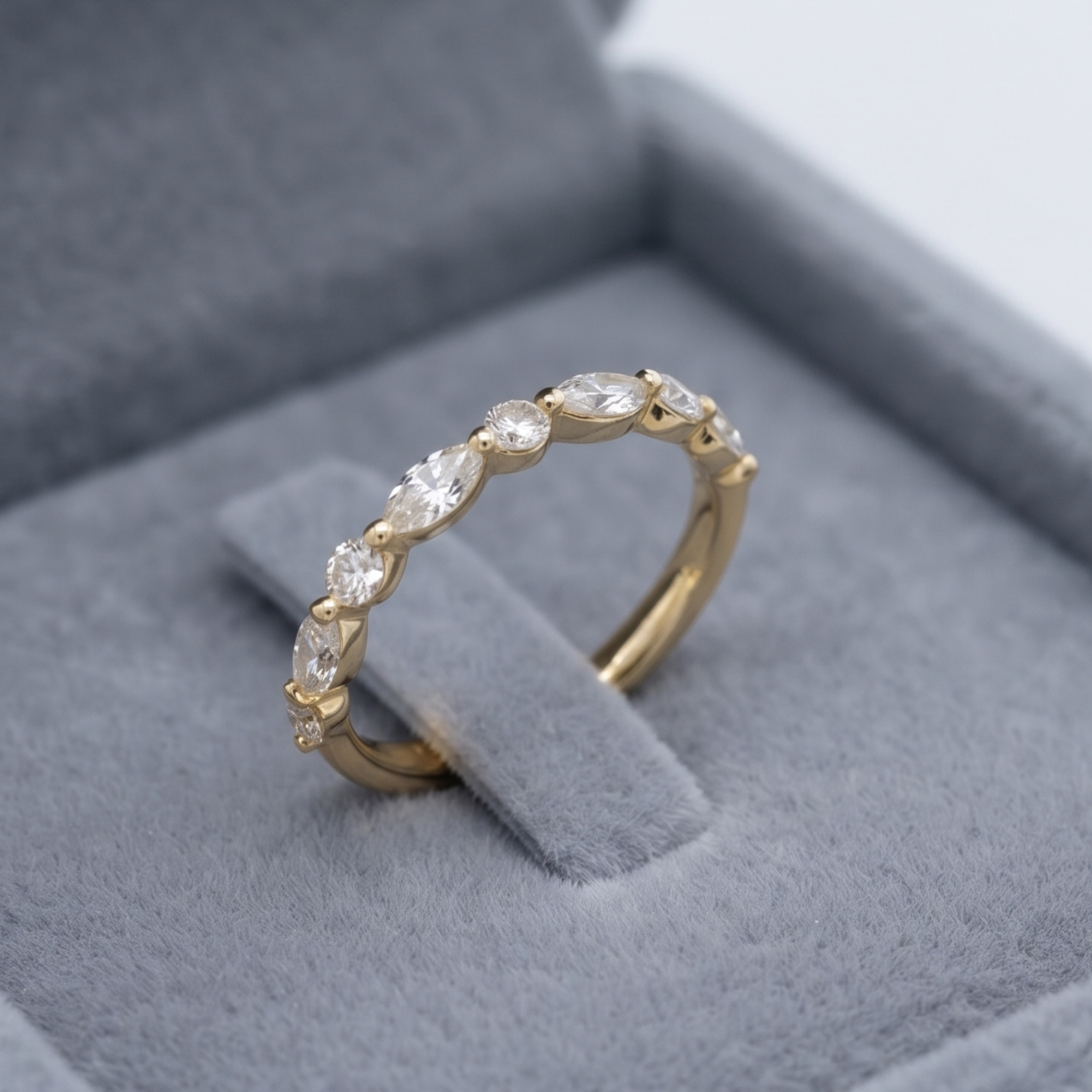 Marquise and round diamond wedding band by Kiashaa Jewellery in polished yellow gold.