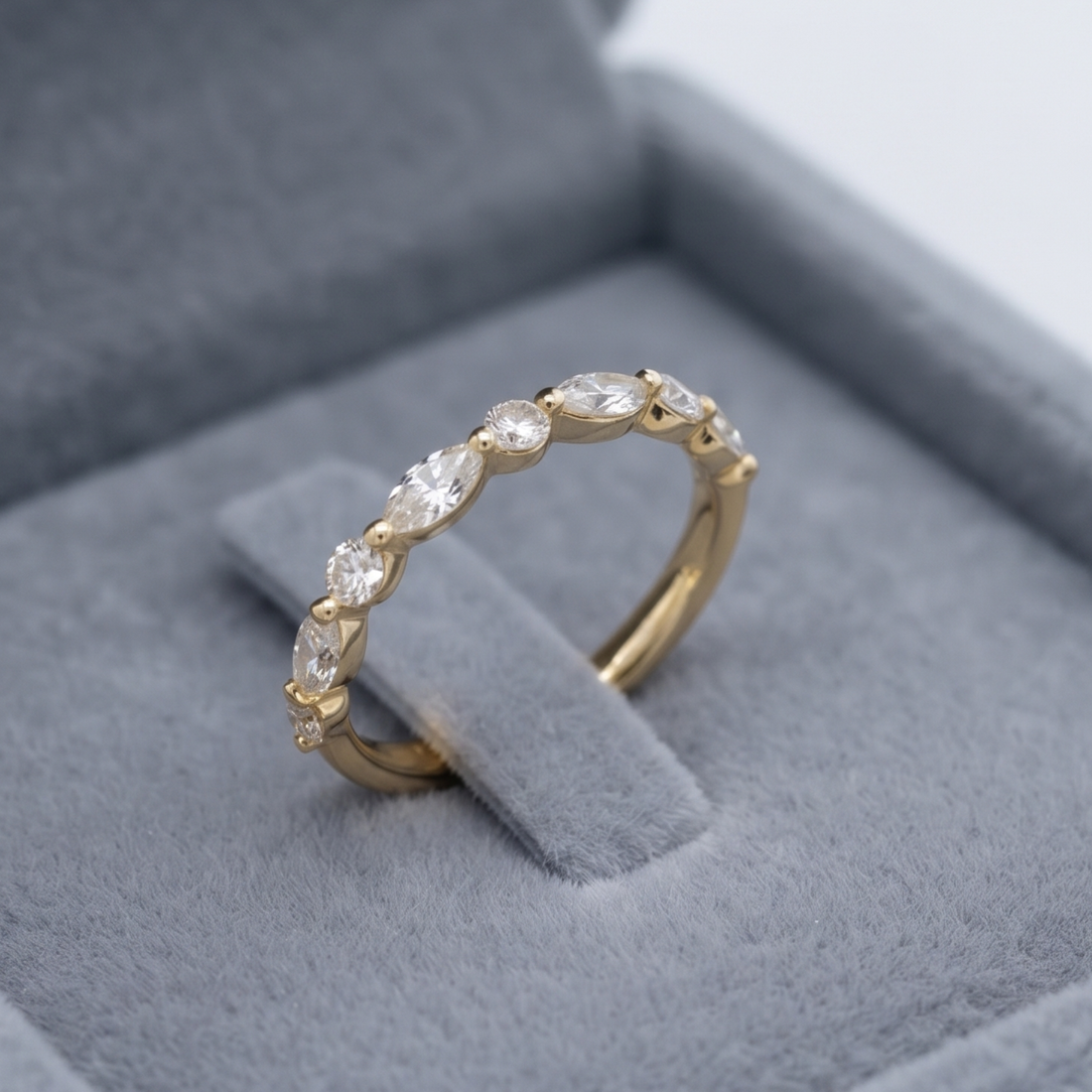 Marquise and round diamond wedding band by Kiashaa Jewellery in polished yellow gold.