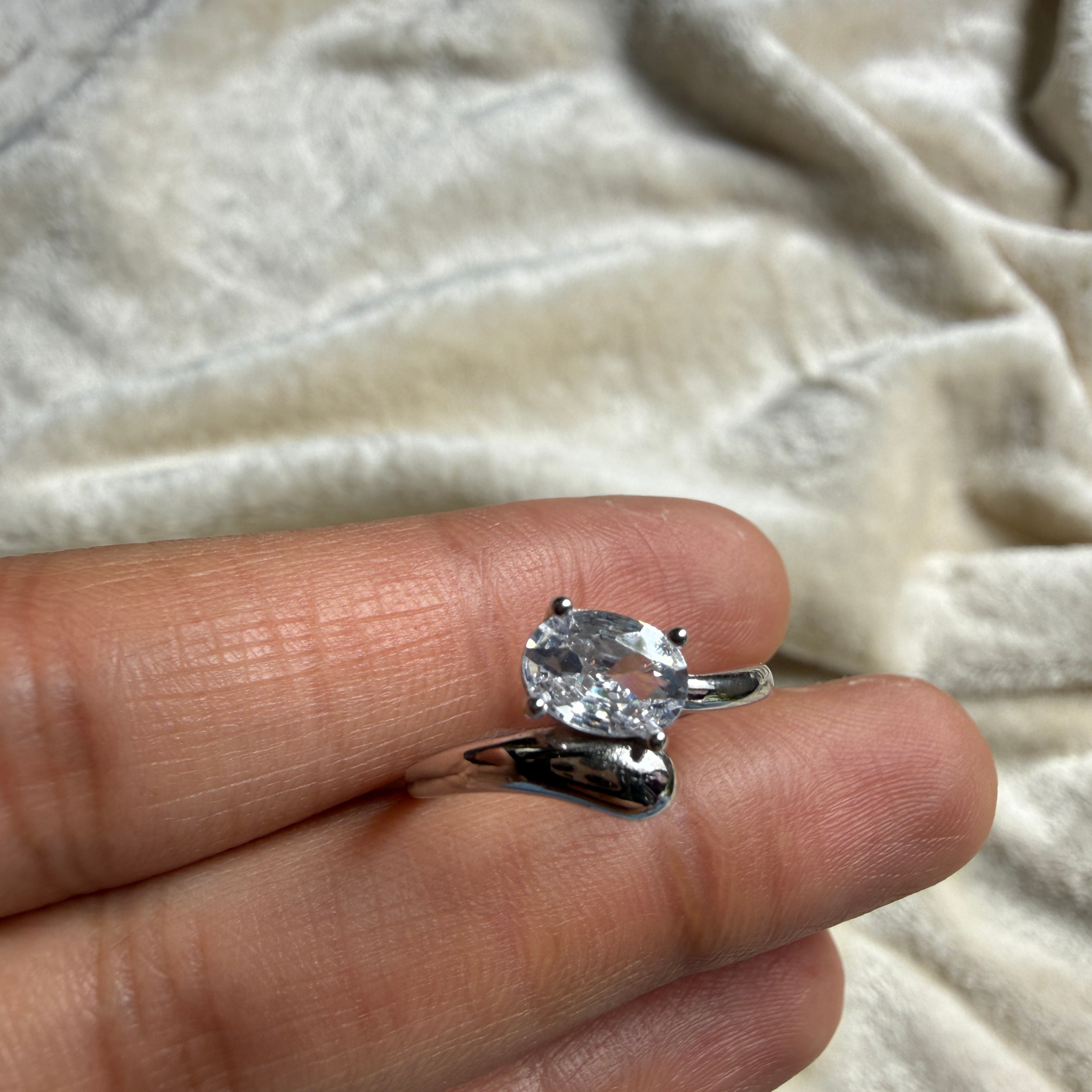 Oval lab-grown diamond bypass solitaire ring in white gold by Kiashaa Jewellery.