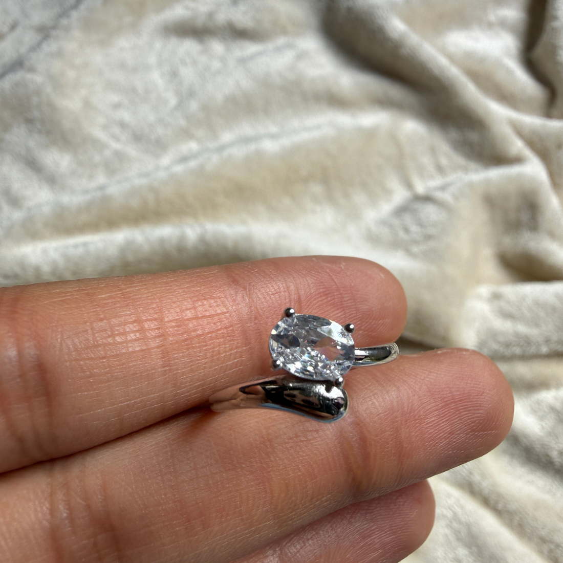 Oval lab-grown diamond bypass solitaire ring in white gold by Kiashaa Jewellery.