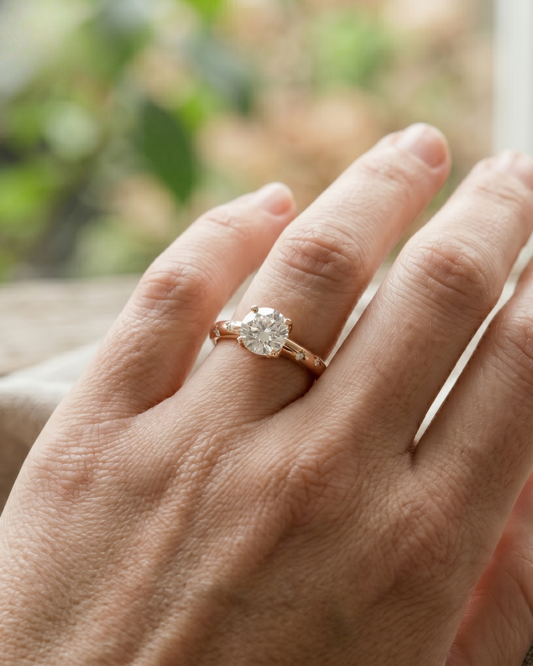 Kiashaa Jewellery round diamond solitaire ring in rose gold with an elegant tapered band and high-polish finish.