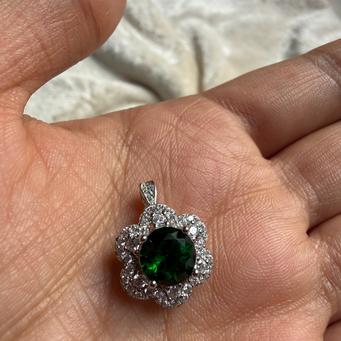 Green gemstone floral halo ring with lab-grown diamonds by Kiashaa Jewellery.