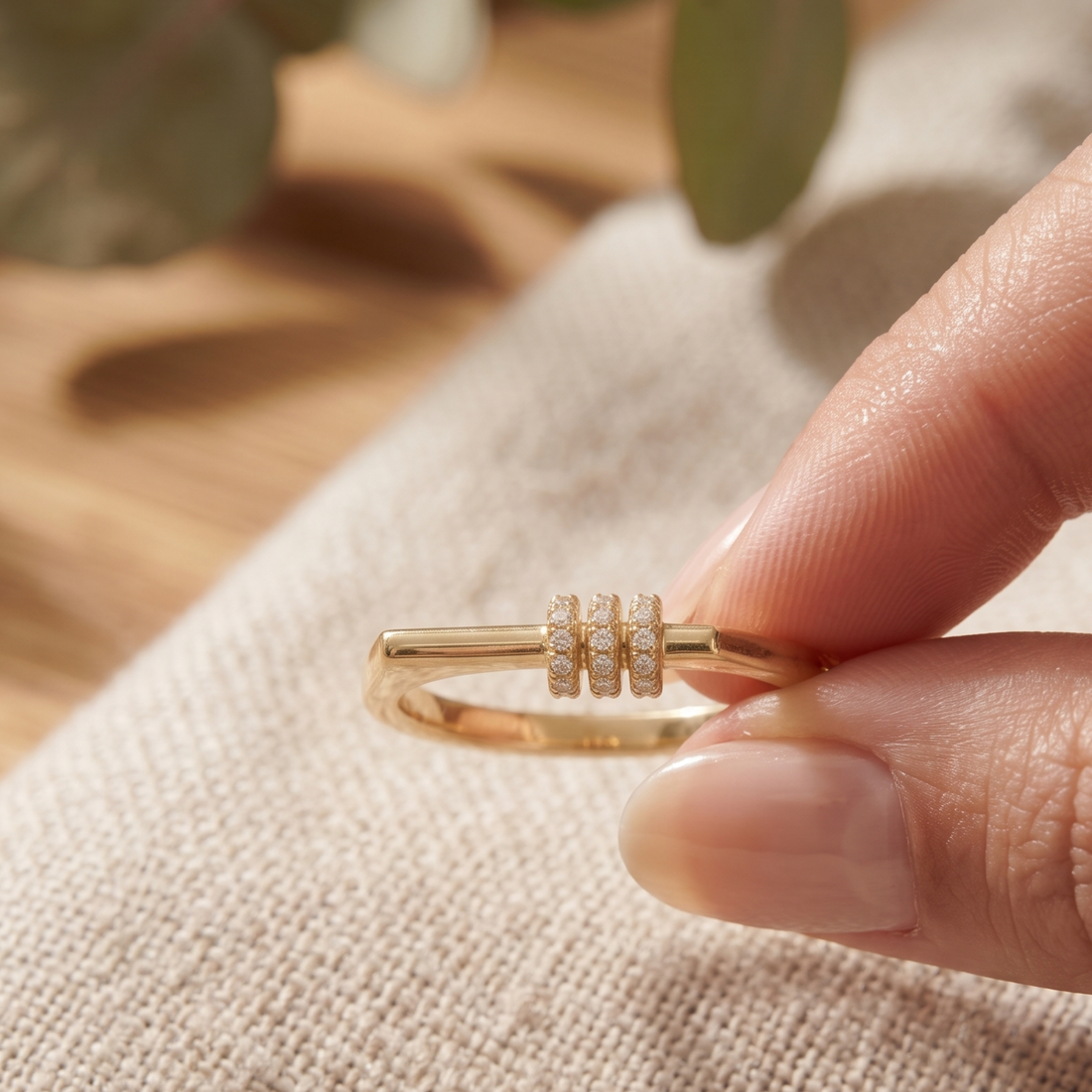 Kiashaa Jewellery 0.21 CTW triple-row diamond ring in polished yellow gold.
