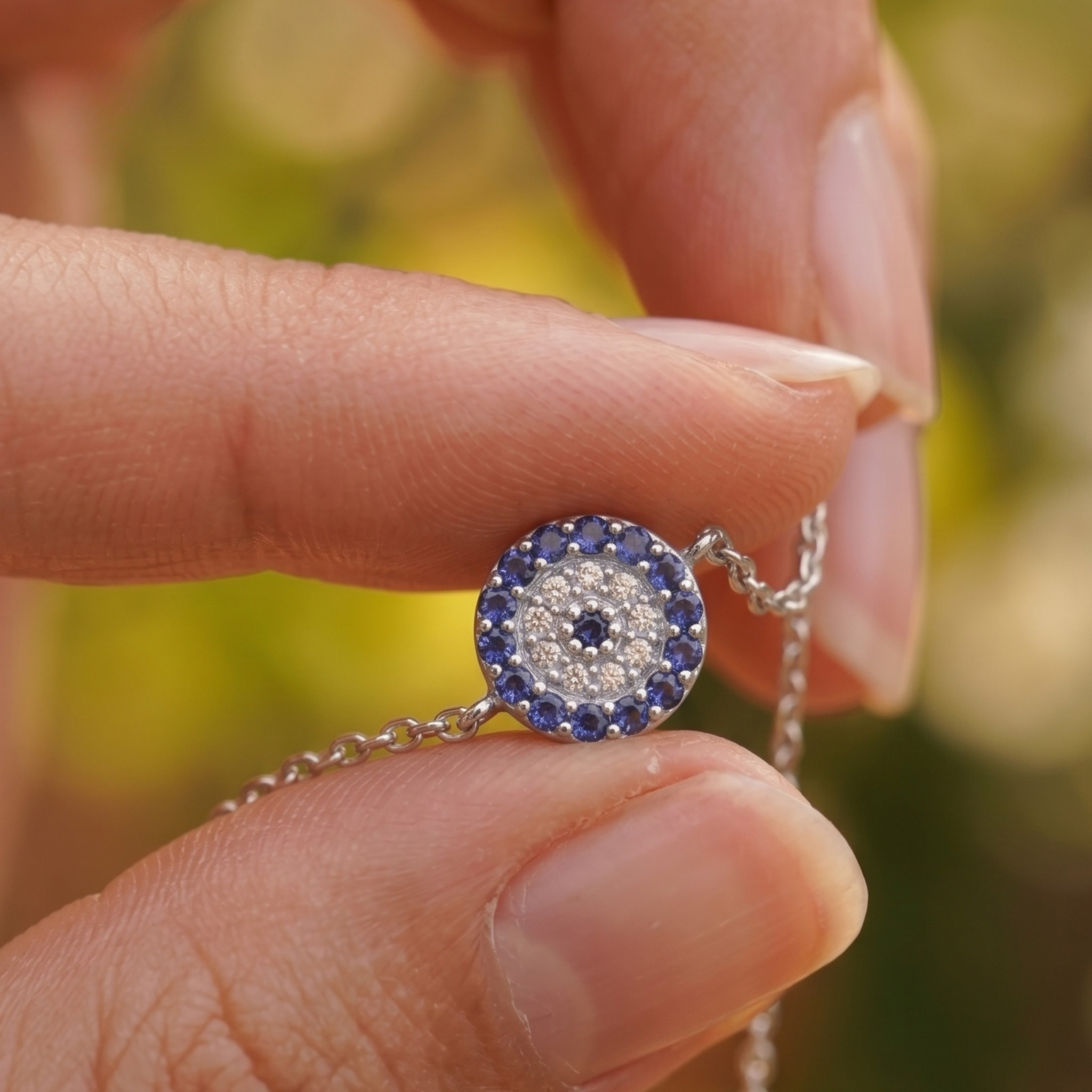 1.00 CT blue gemstone and diamond evil eye bracelet in yellow gold by Kiashaa Jewellery.