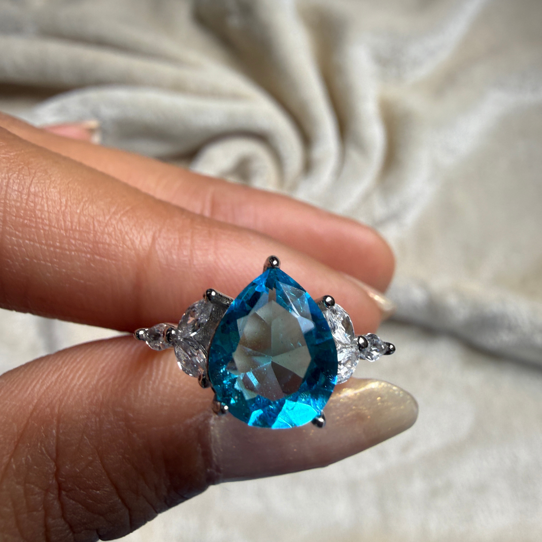 Blue pear gemstone and marquise lab-grown diamond ring by Kiashaa Jewellery.