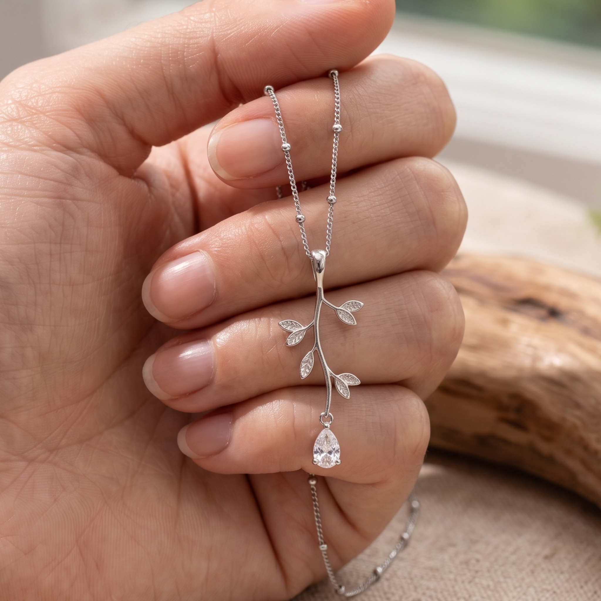 Kiashaa Jewellery 0.39 CT pear diamond leaf pendant necklace in polished yellow gold.
